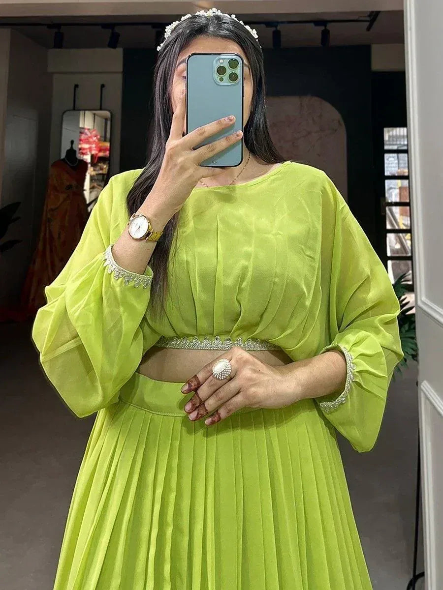 Lime green ethnic gown with embellished sleeves and waistband, perfect for Indian festive occasions