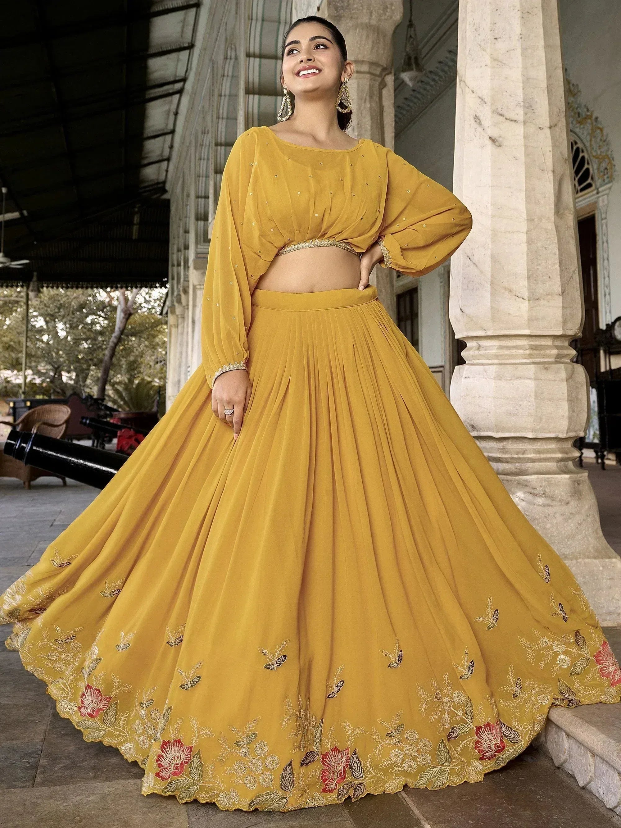 Mustard yellow embroidered lehenga choli with floral detailing, perfect for Indian ethnic occasions