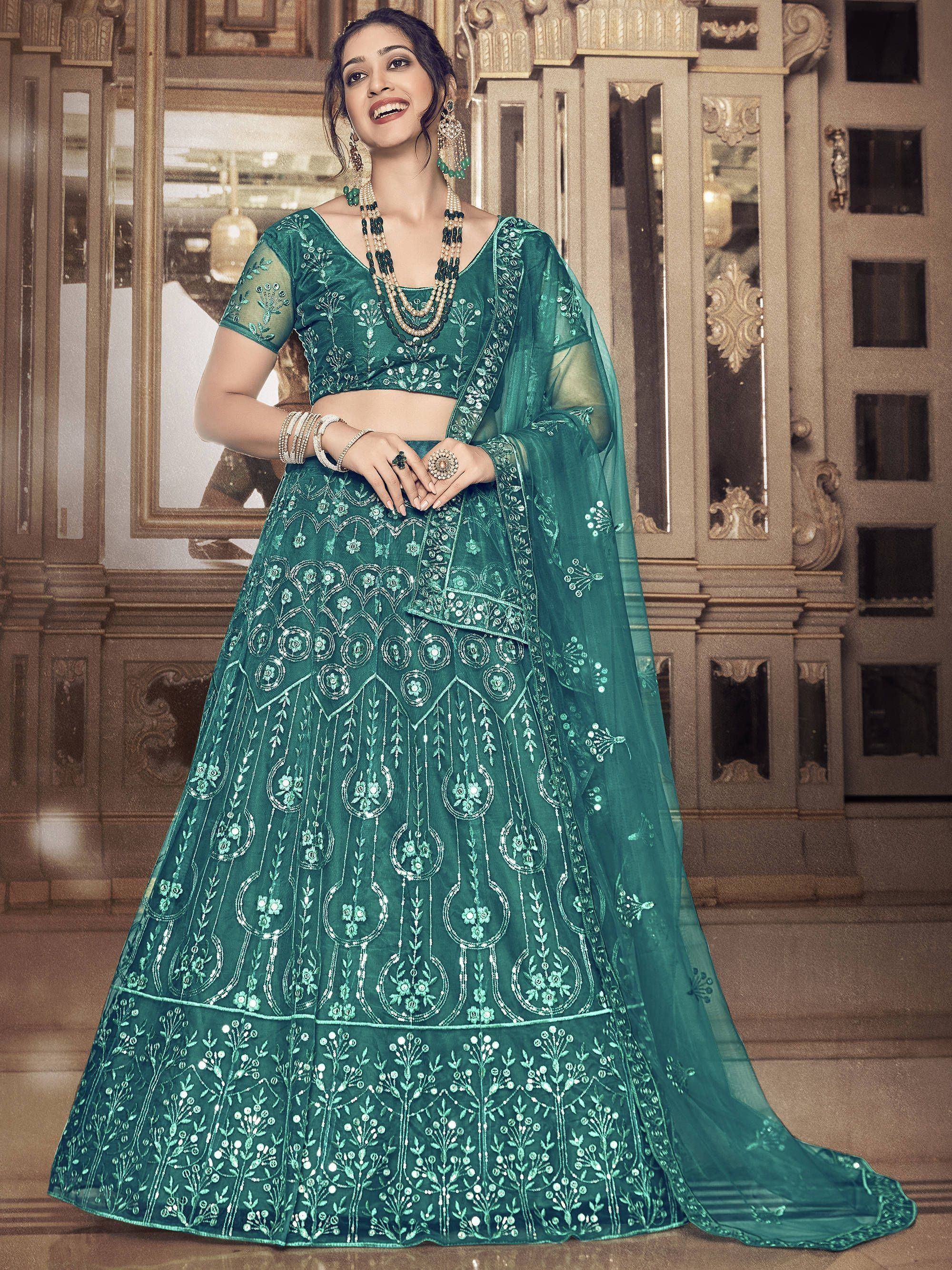 Emerald green designer lehenga choli with intricate embroidery and sheer dupatta for Indian ethnic wear