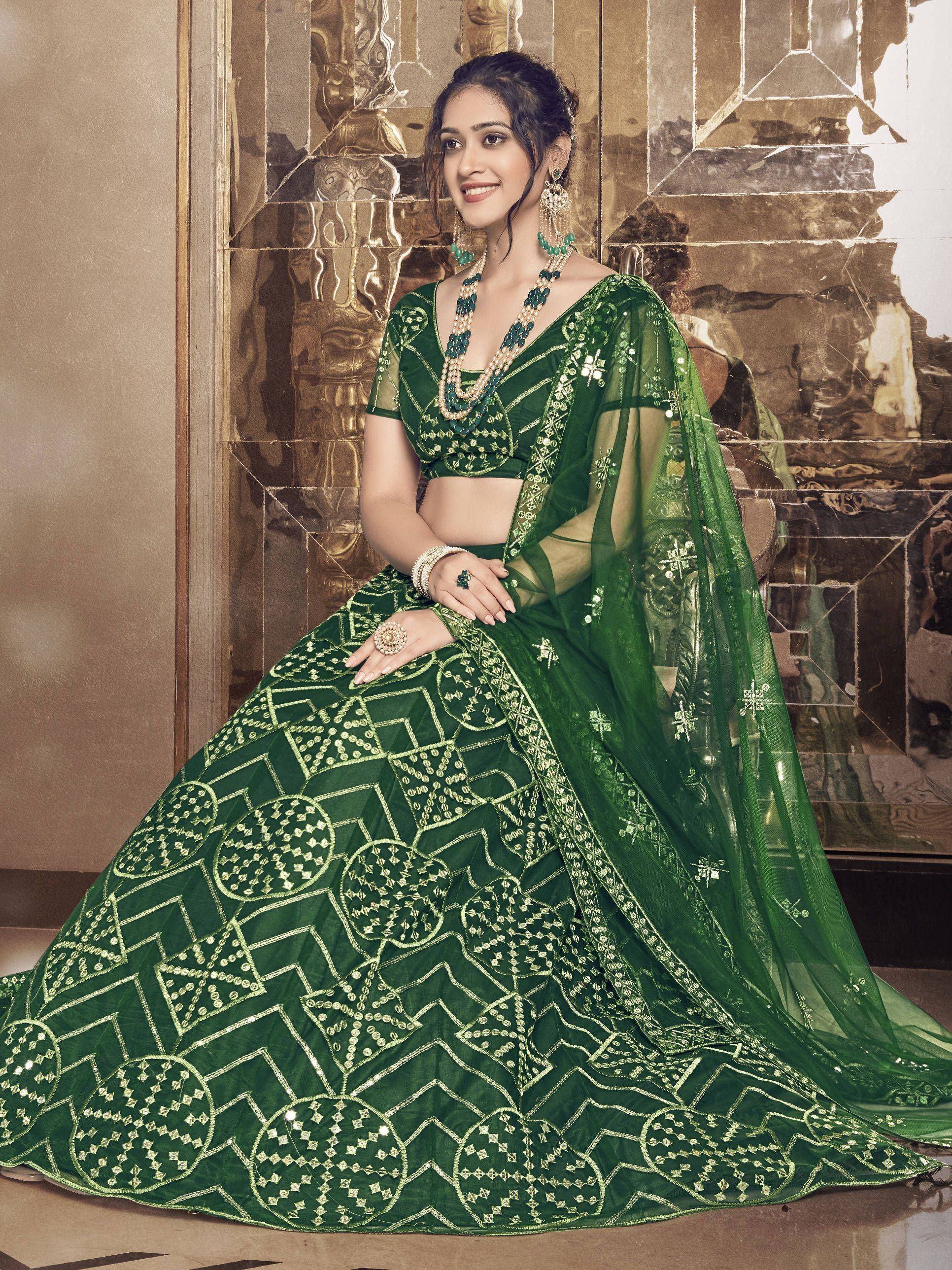 Elegant green designer lehenga choli with gold embroidery, perfect for Indian weddings and festive occasions.