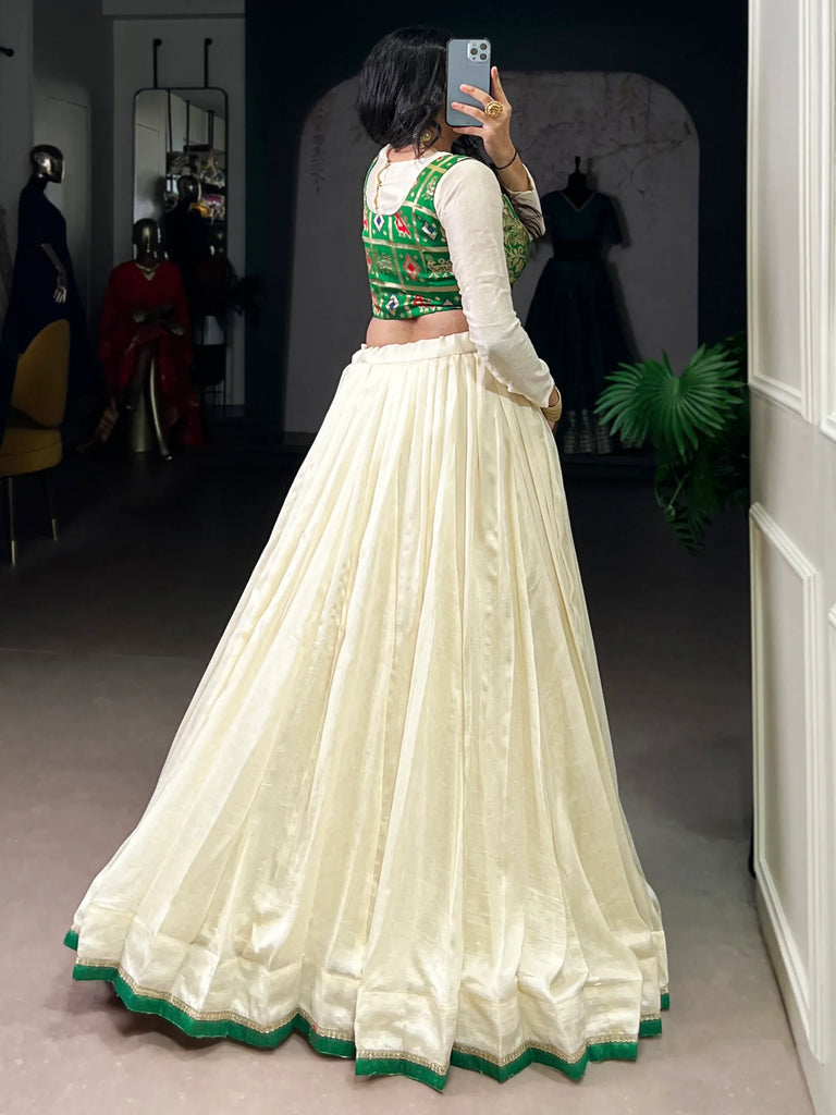 Regal Off-White Lace Work Silk Festive Wear Crop Top Lehenga With Koti