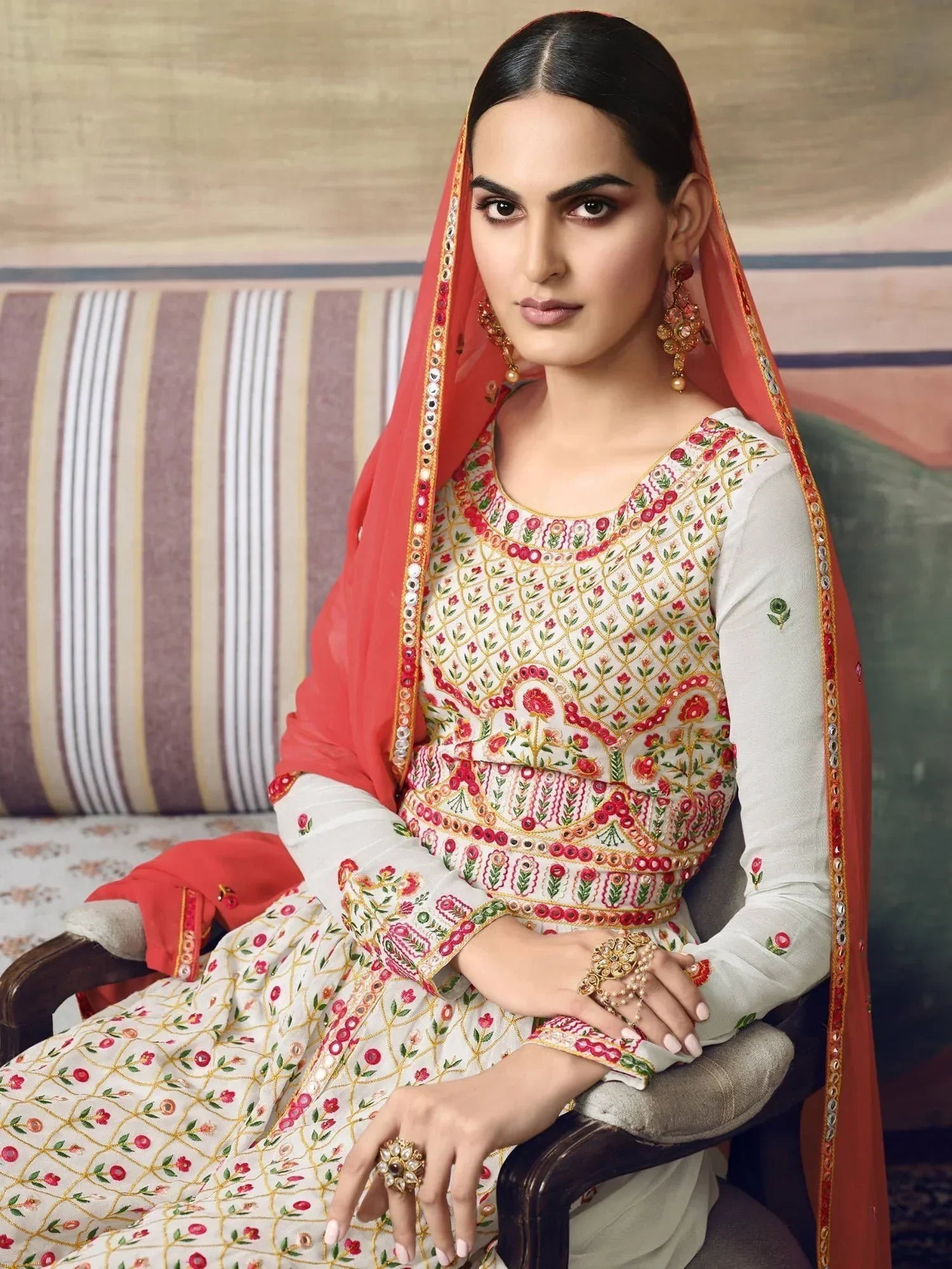 Woman in cream and red embroidered salwar kameez with dupatta, traditional Indian ethnic wear