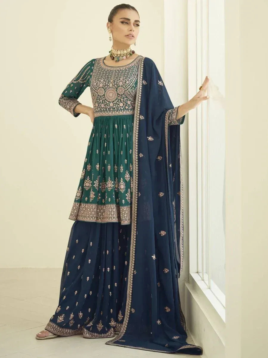 Woman wearing green and navy blue embroidered lehenga choli with dupatta, Indian ethnic wear