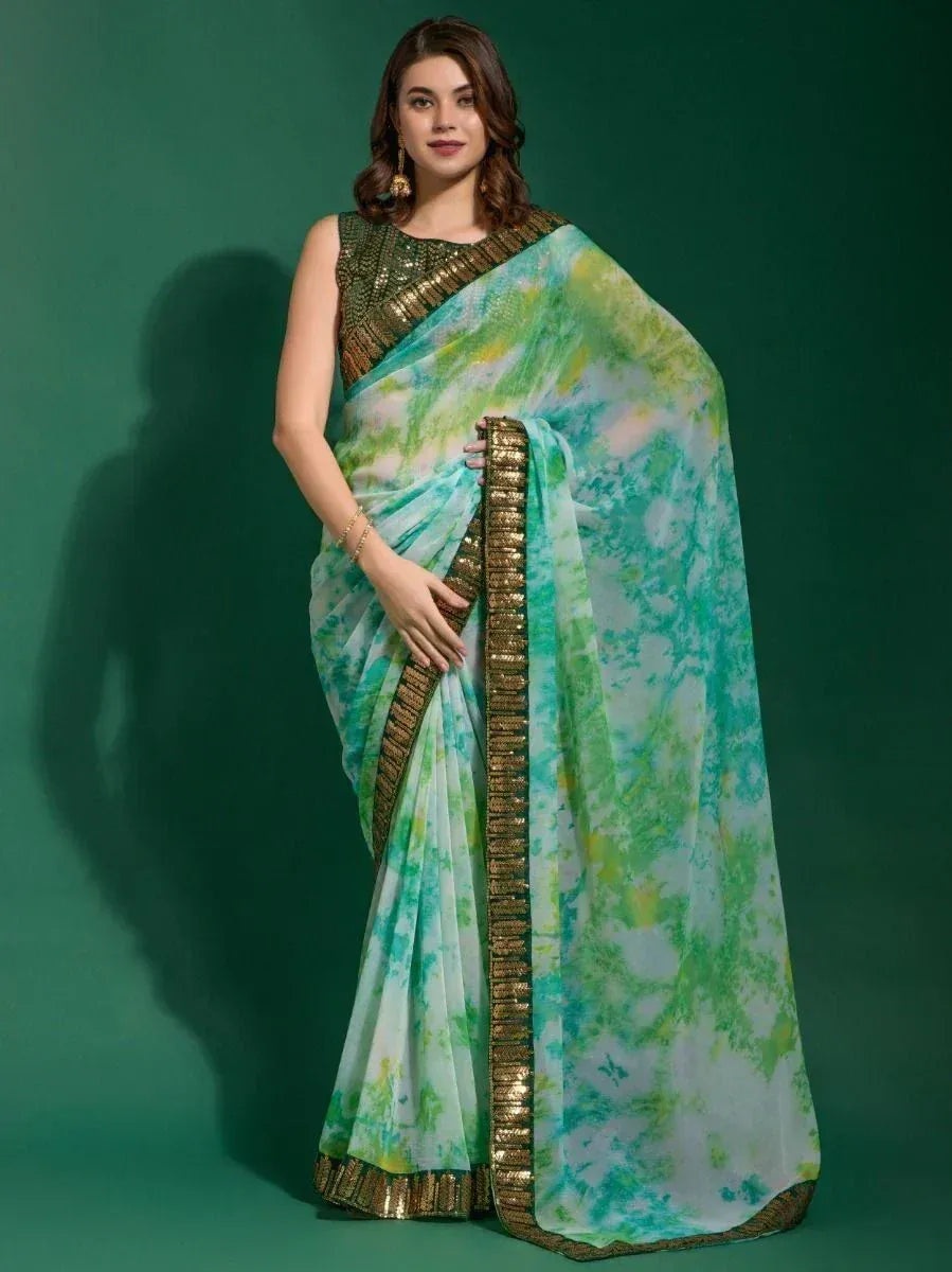 Green tie-dye saree with gold border, paired with sequined blouse, elegant ethnic wear for women