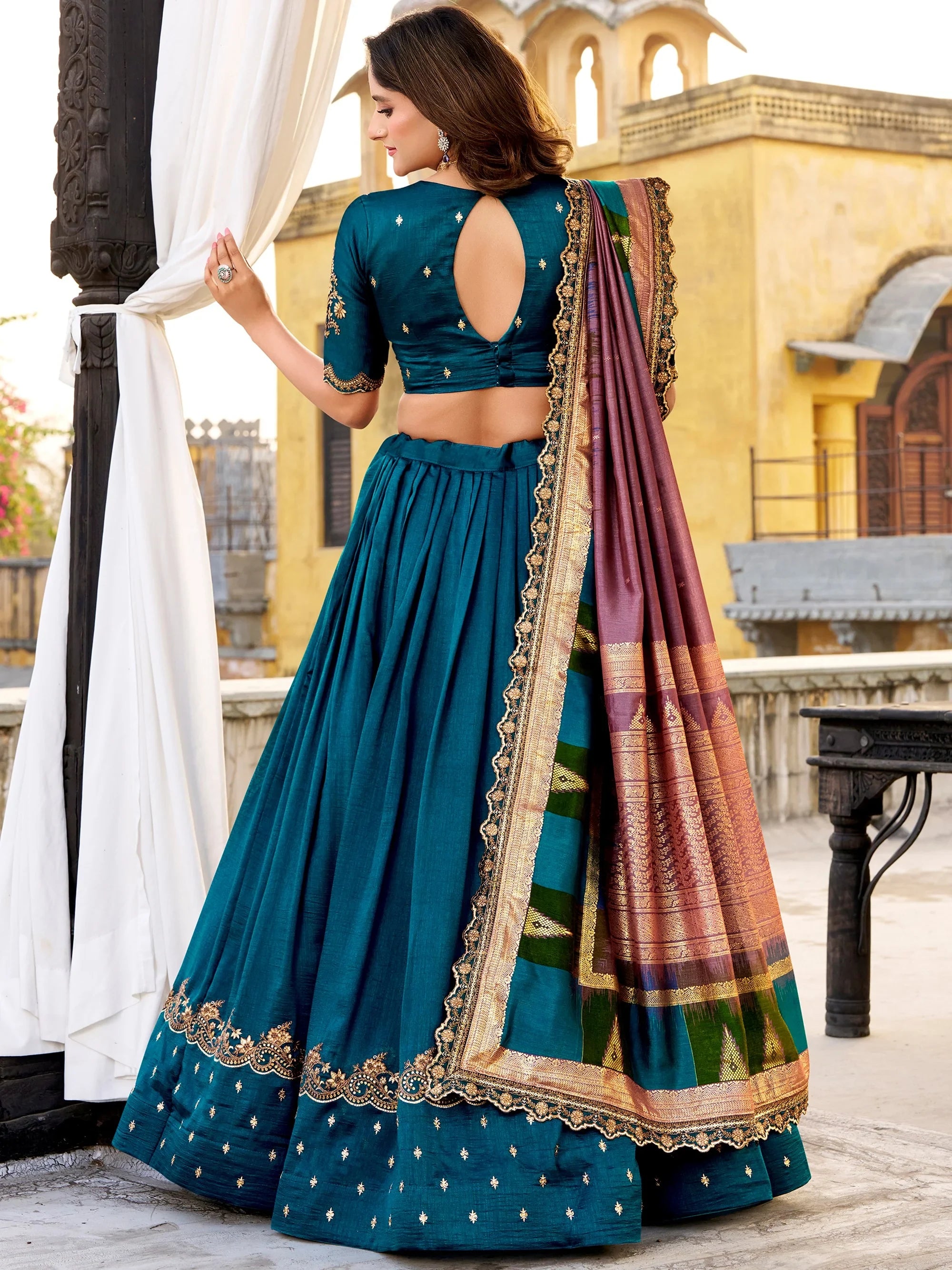 Dazzling Teal Blue Embroidered Silk Wedding Wear Lehenga Choli