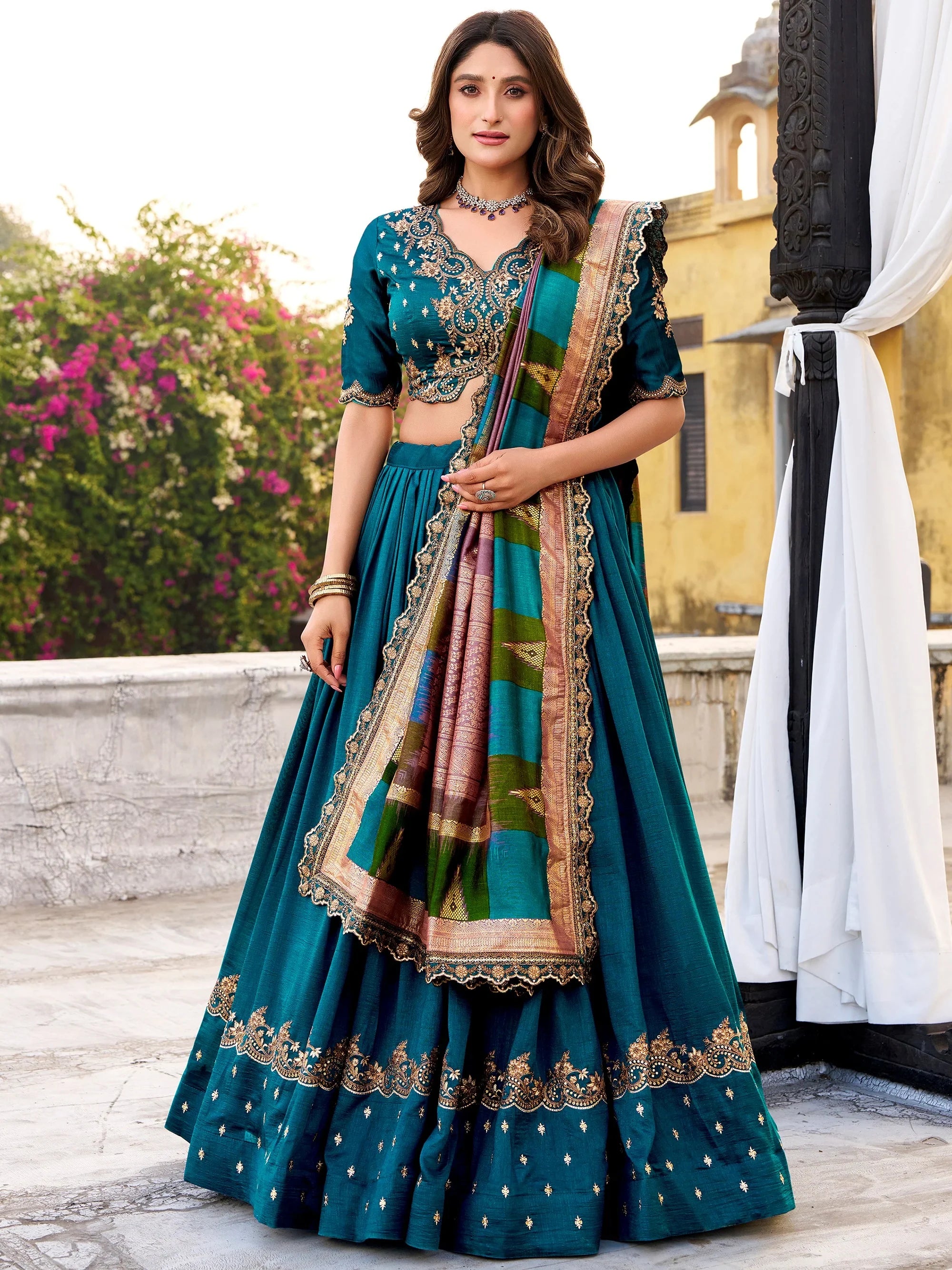 Dazzling Teal Blue Embroidered Silk Wedding Wear Lehenga Choli
