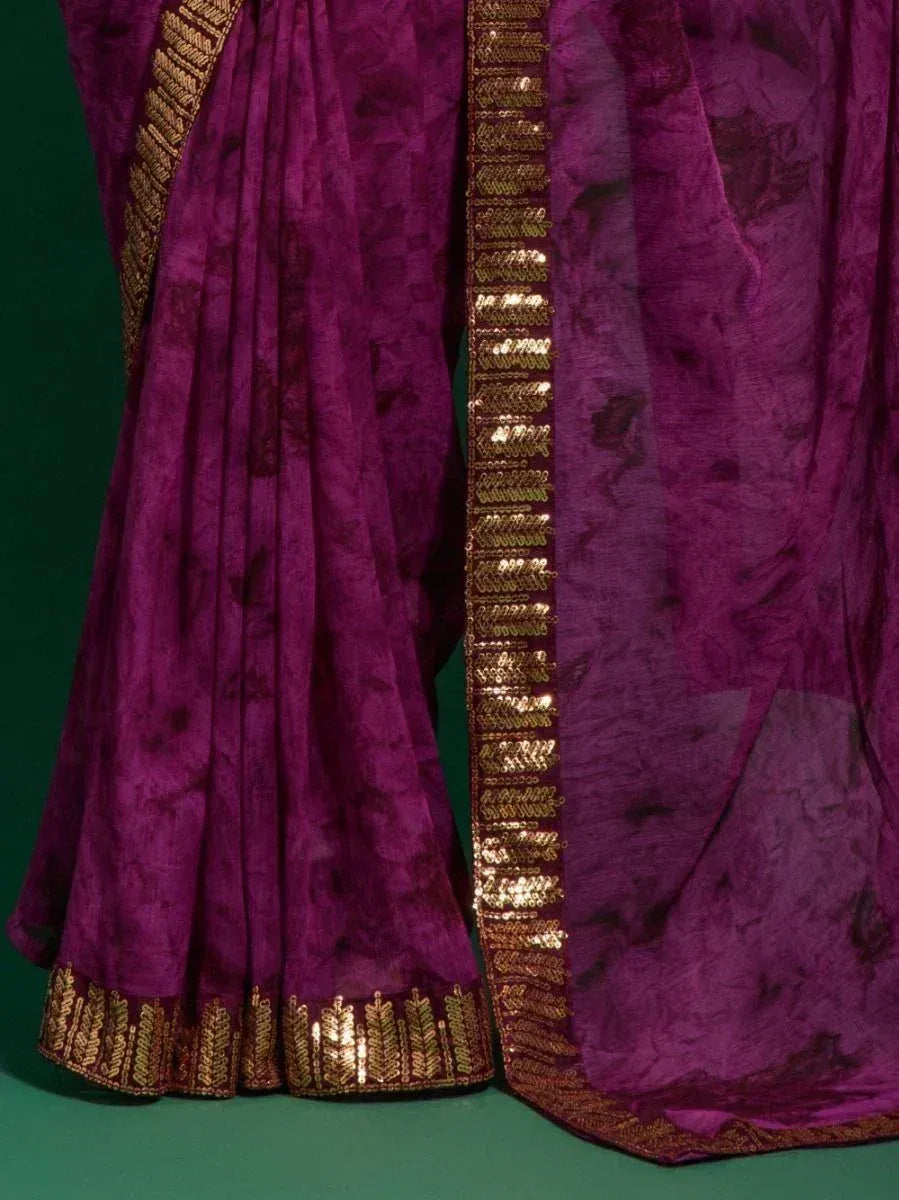 Purple ethnic saree with gold sequin border and pleated design, perfect for festive occasions.