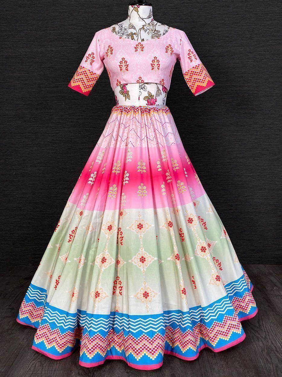 Pink and green printed lehenga choli with floral and geometric patterns, perfect for Indian ethnic wear