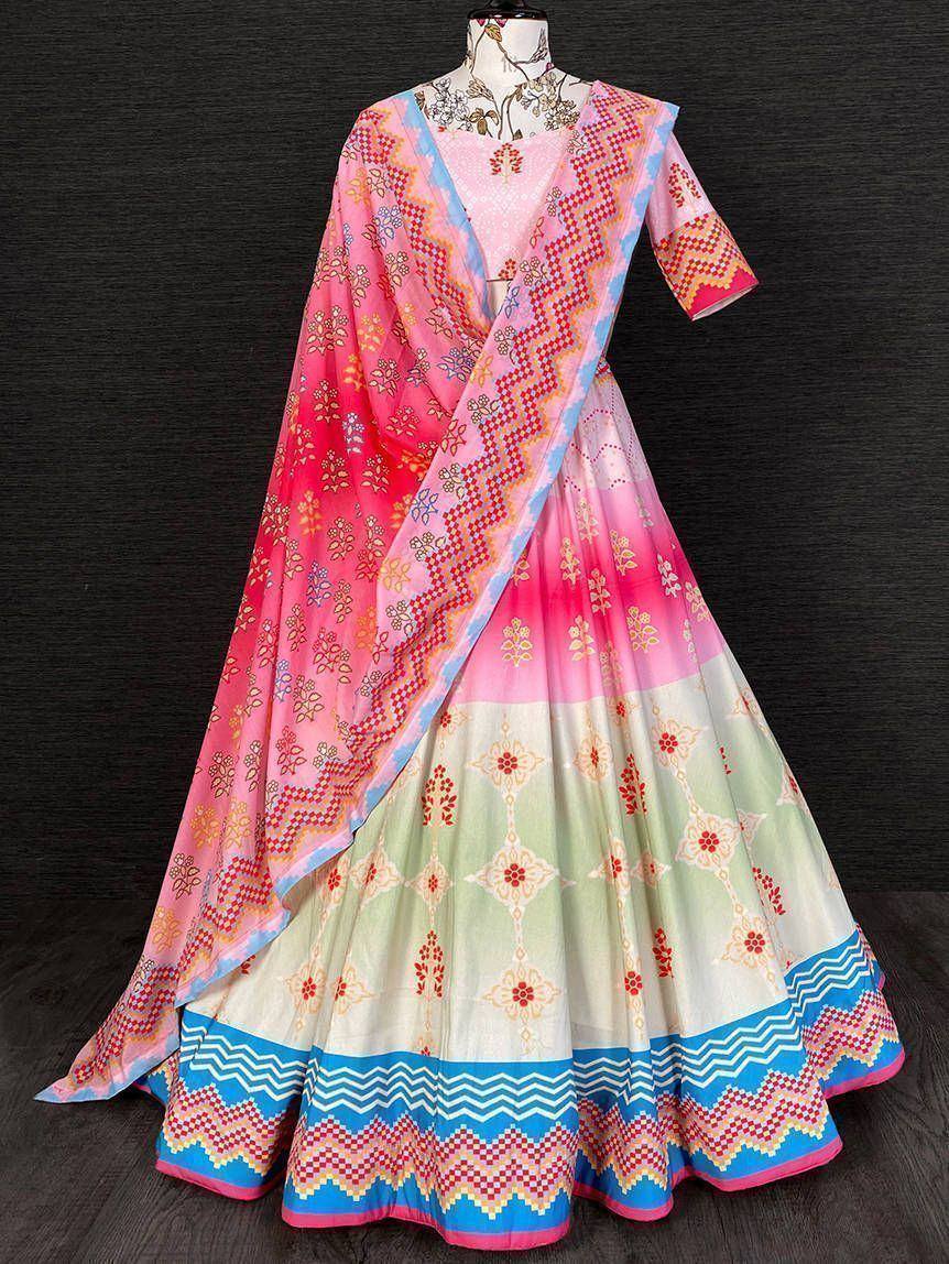 Pink and green printed lehenga choli with blue border, perfect for Indian ethnic wear