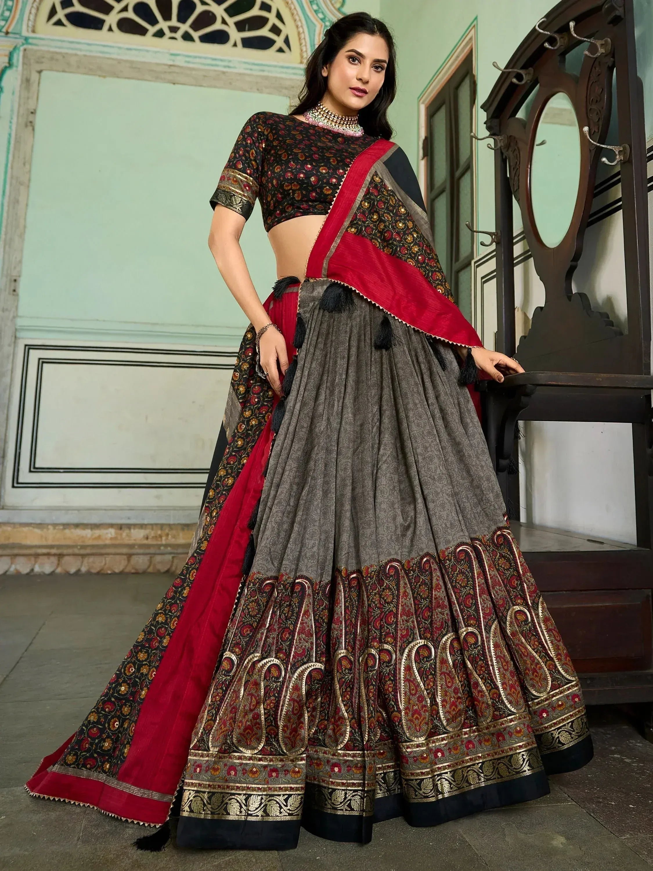 Grey and red printed lehenga choli with floral blouse and tassel detailing, ethnic Indian wear