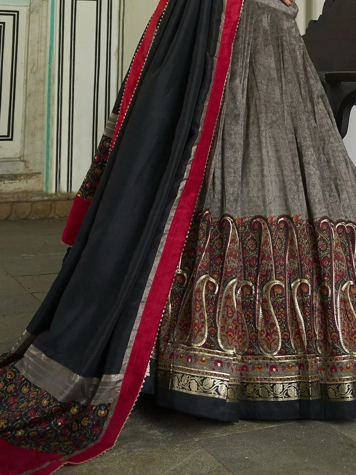 Grey and black lehenga with red velvet border and intricate paisley embroidery, Indian ethnic wear