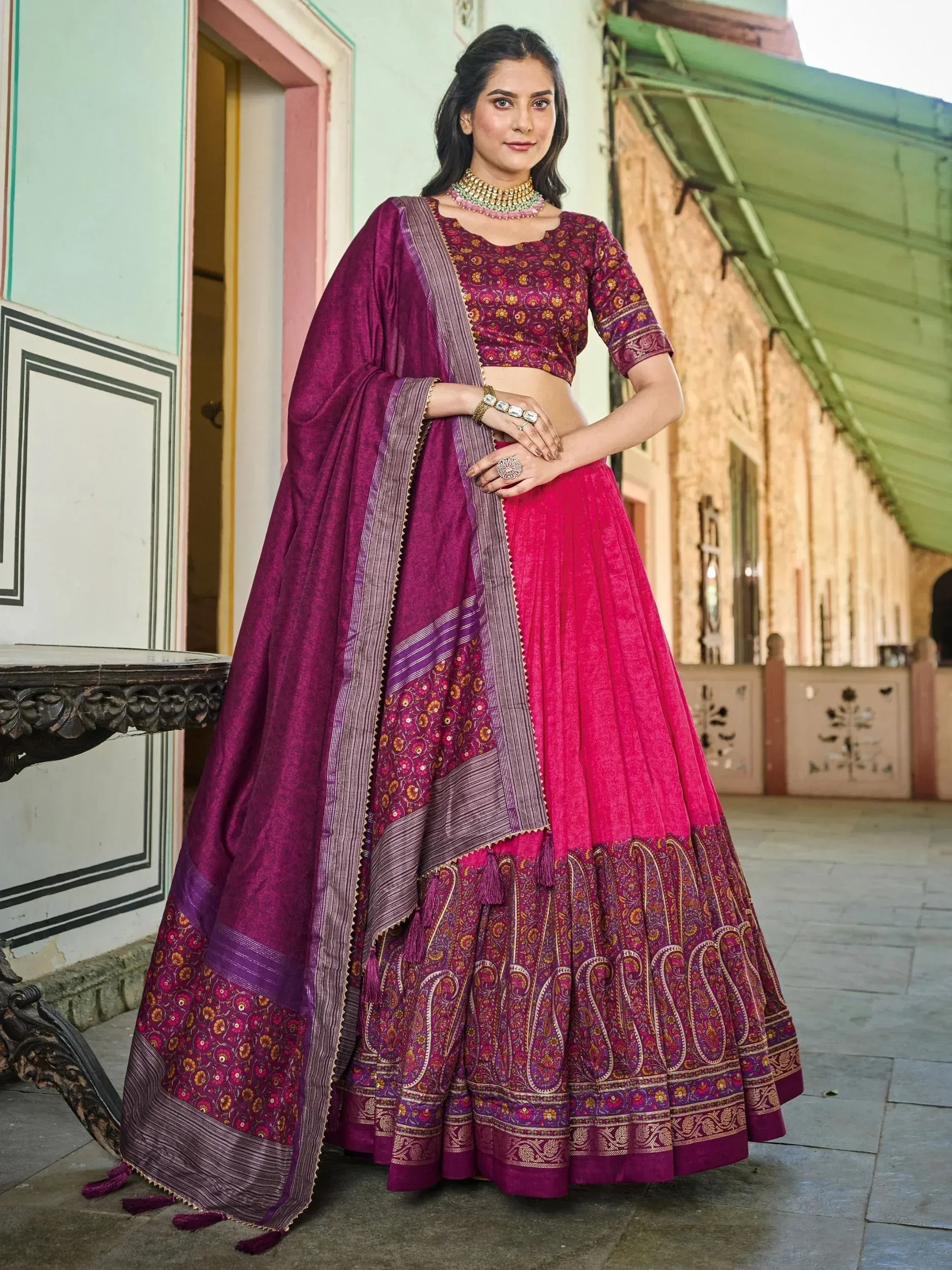 Purple and pink designer lehenga choli with floral and paisley print, perfect for Indian ethnic occasions