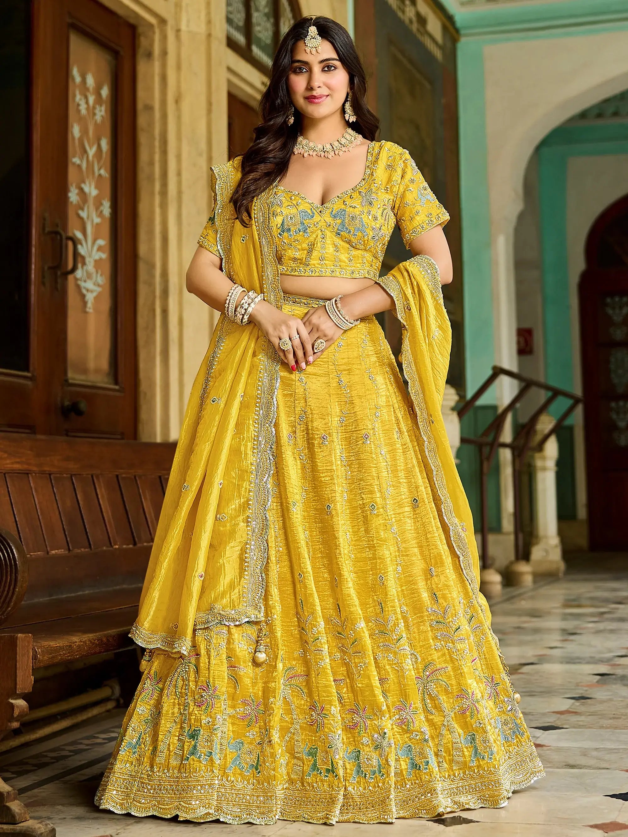 Pretty Yellow Embroidered Crush Wedding Wear Lehenga Choli