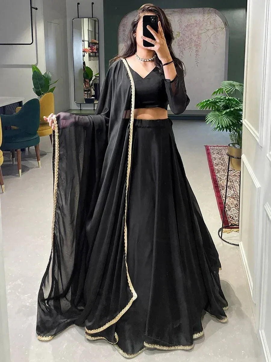 Black lehenga choli with gold trim, elegant ethnic wear for women
