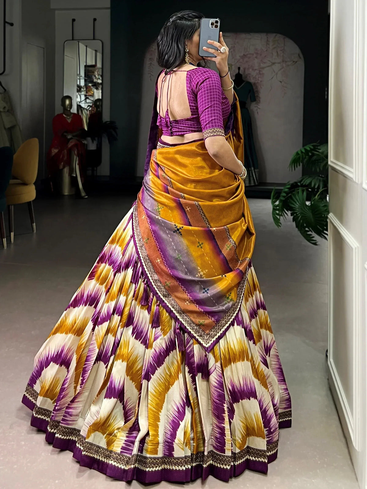 Vibrant purple and gold ikat lehenga choli with backless blouse, perfect for ethnic occasions