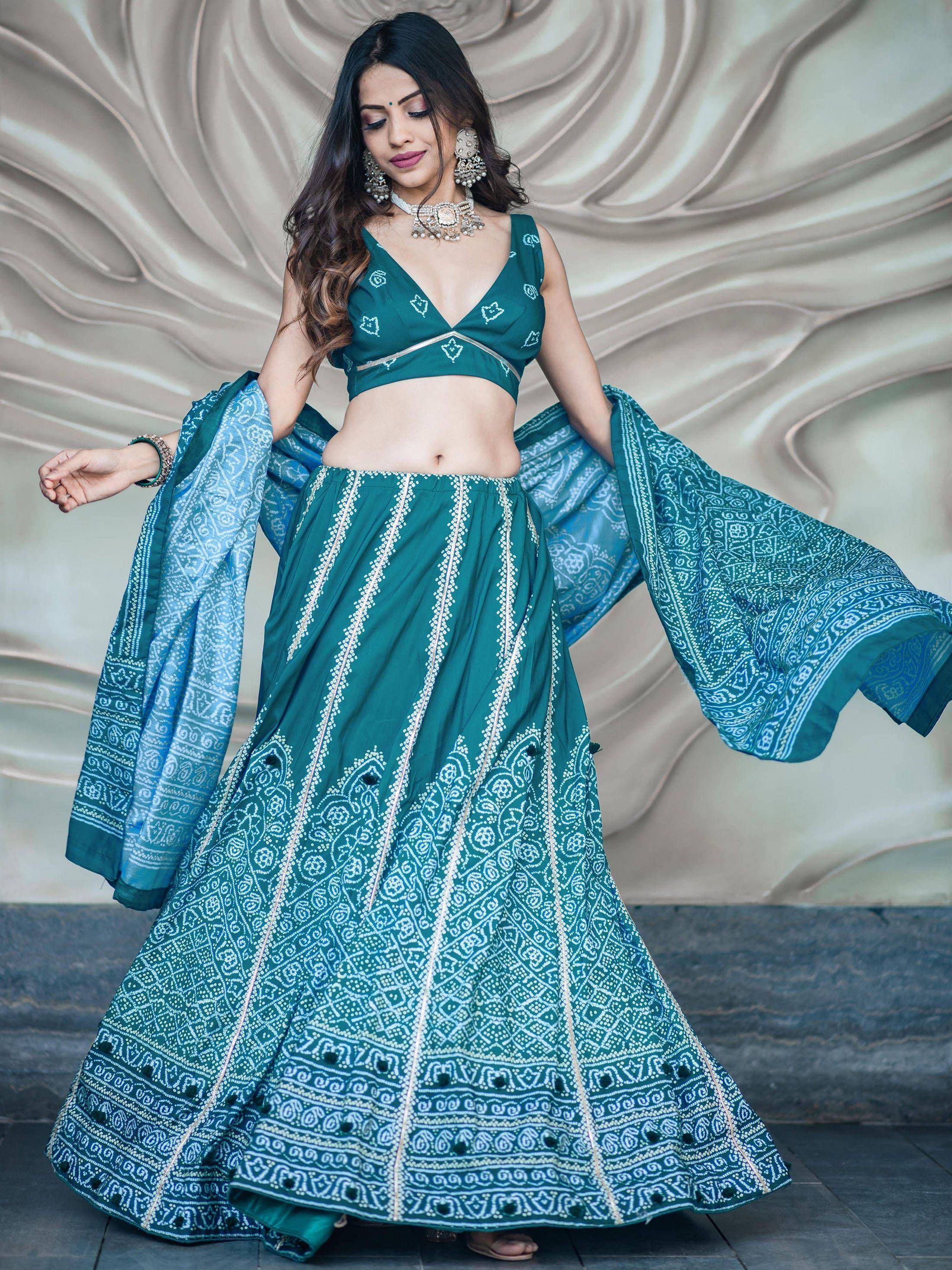 Teal green lehenga choli with white bandhani print, perfect for Indian ethnic wear and festive occasions.