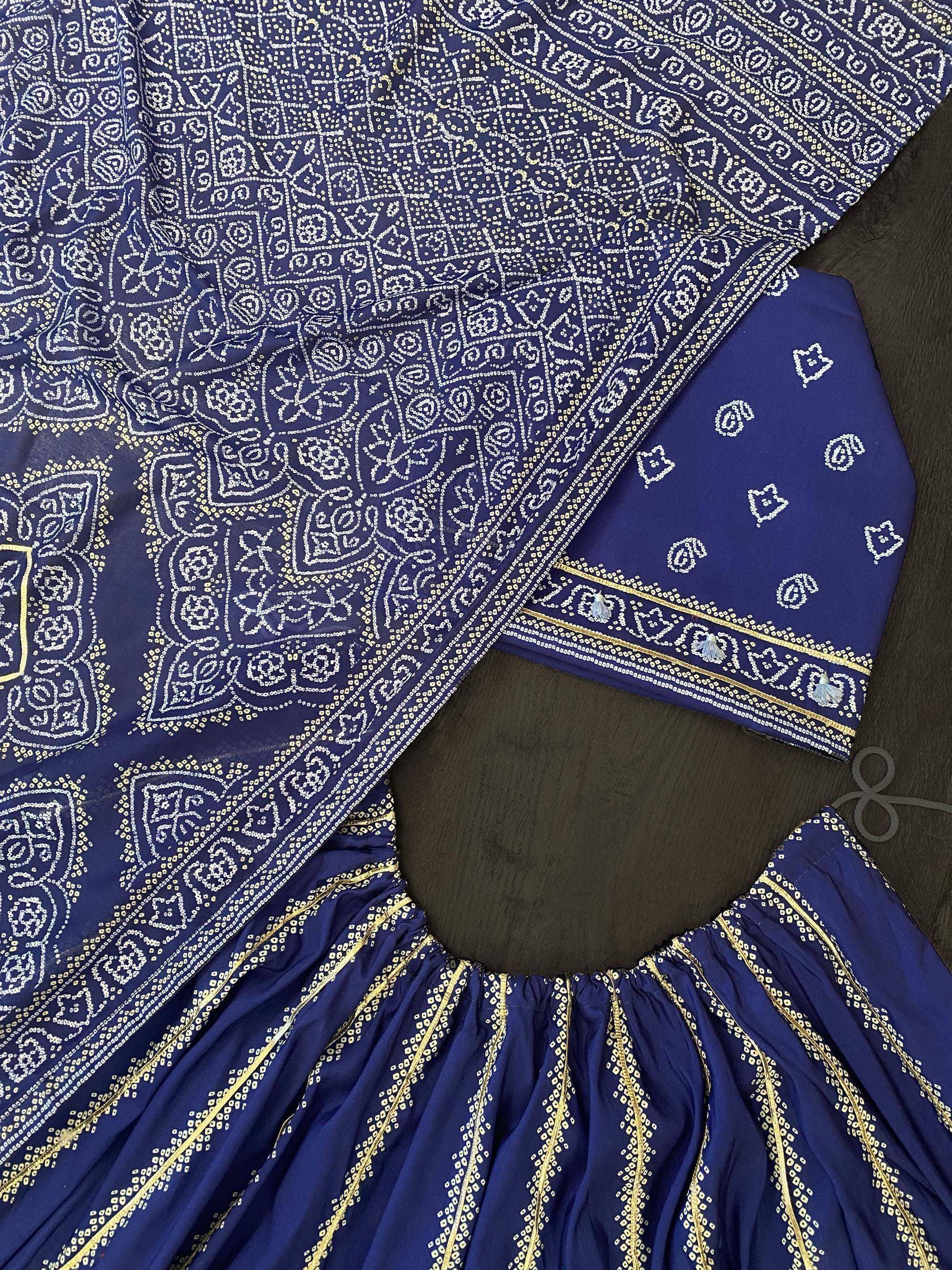 Navy blue ethnic lehenga choli with white and gold bandhani print, perfect for Indian weddings and festivals