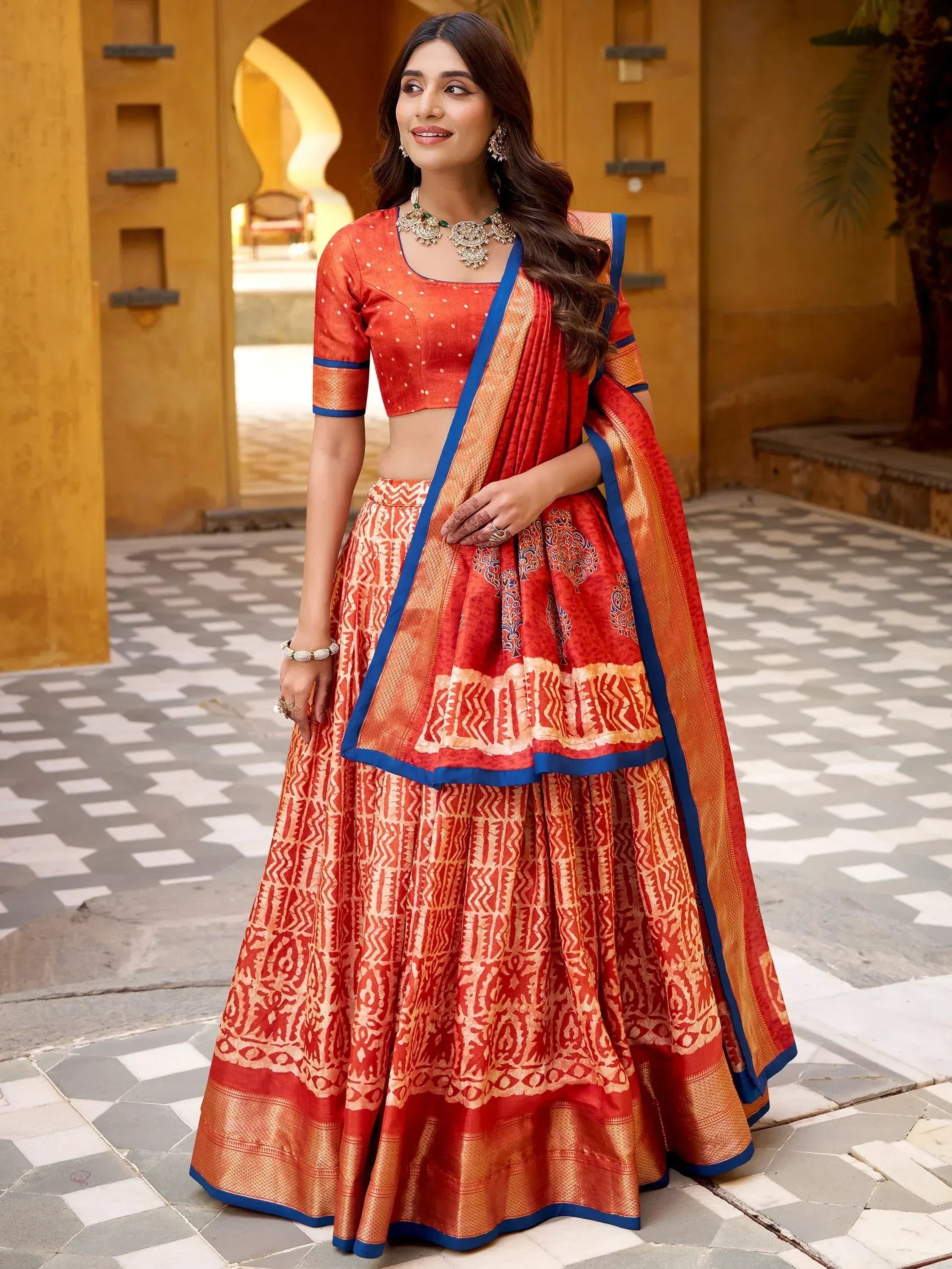 Enchanting Orange Printed Dola Silk Function Wear Lehenga Choli