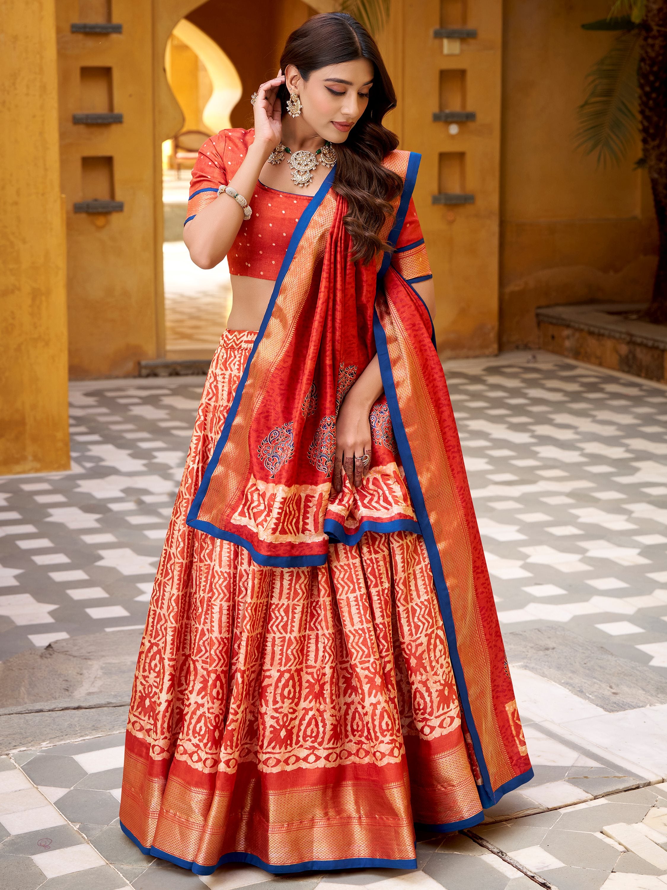 Enchanting Orange Printed Dola Silk Function Wear Lehenga Choli