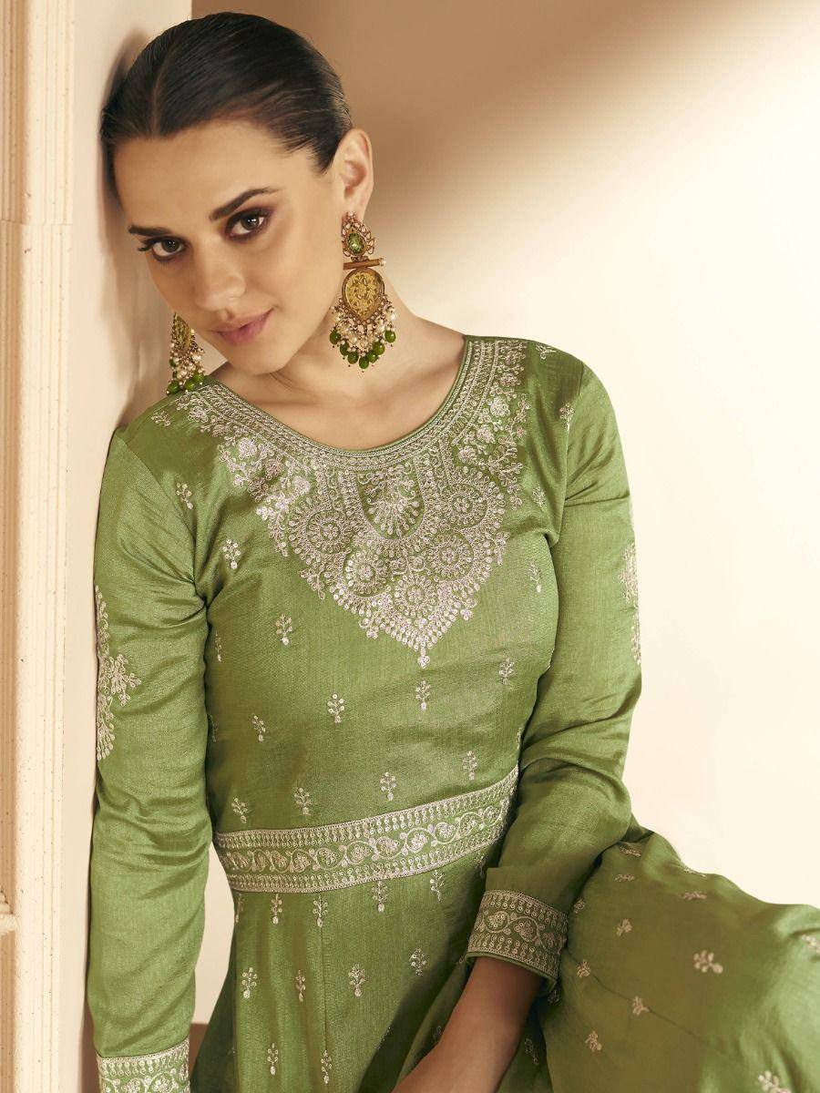 Green embroidered ethnic gown with silver detailing and matching jewelry for Indian wear