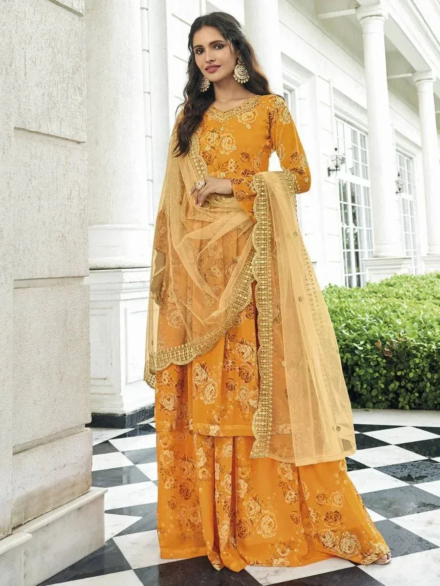 Elegant mustard yellow floral salwar kameez with gold embroidery and dupatta, perfect for Indian ethnic occasions
