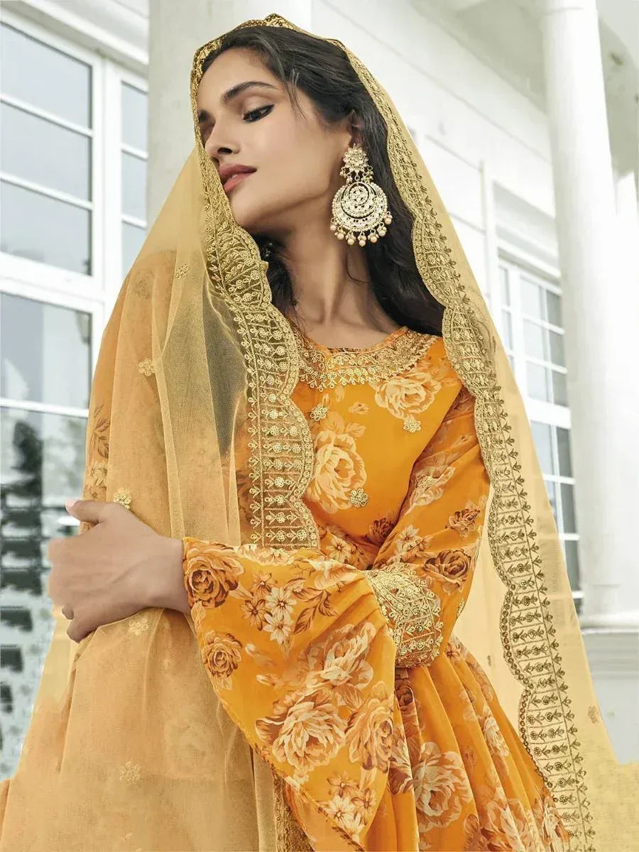 Elegant mustard yellow floral salwar kameez with gold embroidery and matching dupatta, perfect for ethnic occasions.