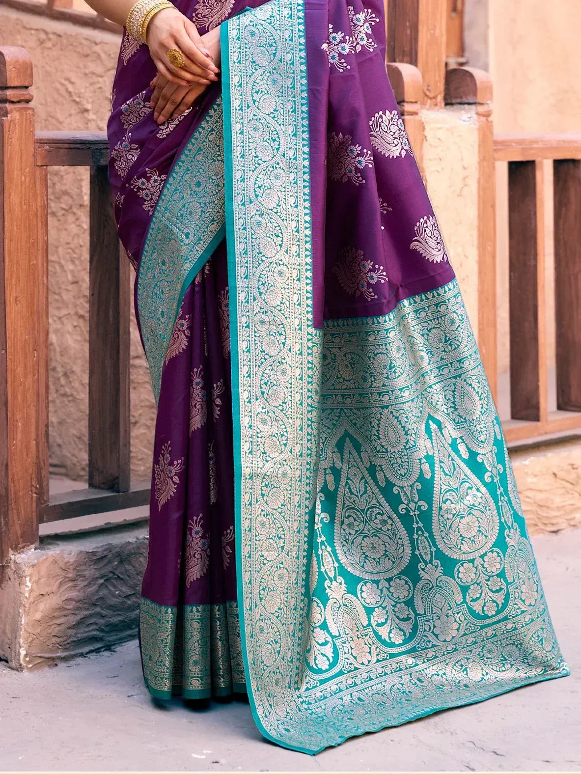 Purple and teal designer saree with intricate paisley embroidery, perfect for ethnic occasions