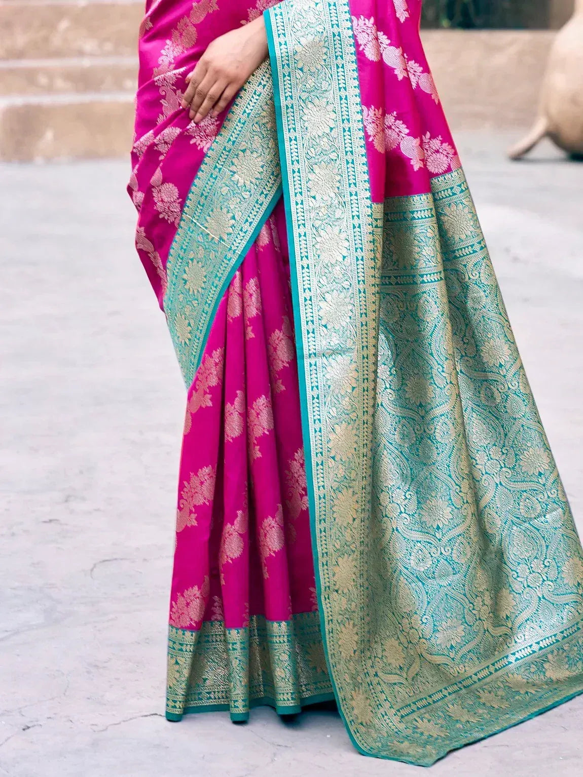 Fuchsia silk saree with teal gold zari border, floral motifs, perfect for Indian ethnic wear occasions