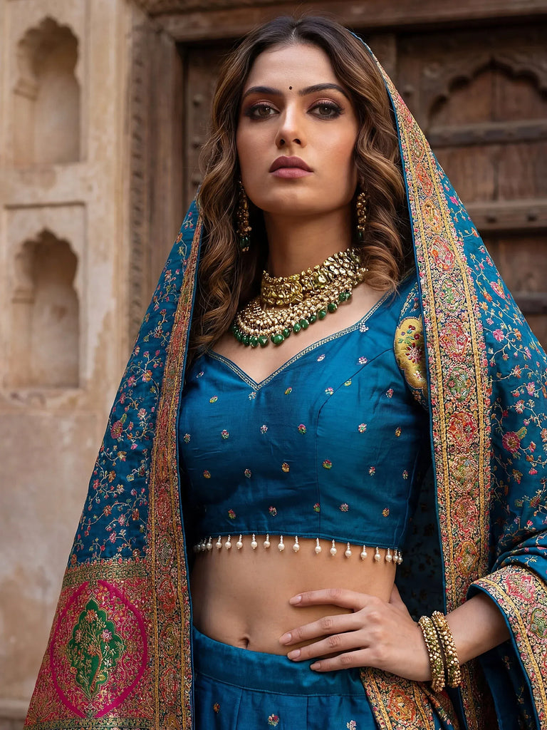 Fabulous Teal Blue Zari Weaving Silk Reception Wear Lehenga Choli
