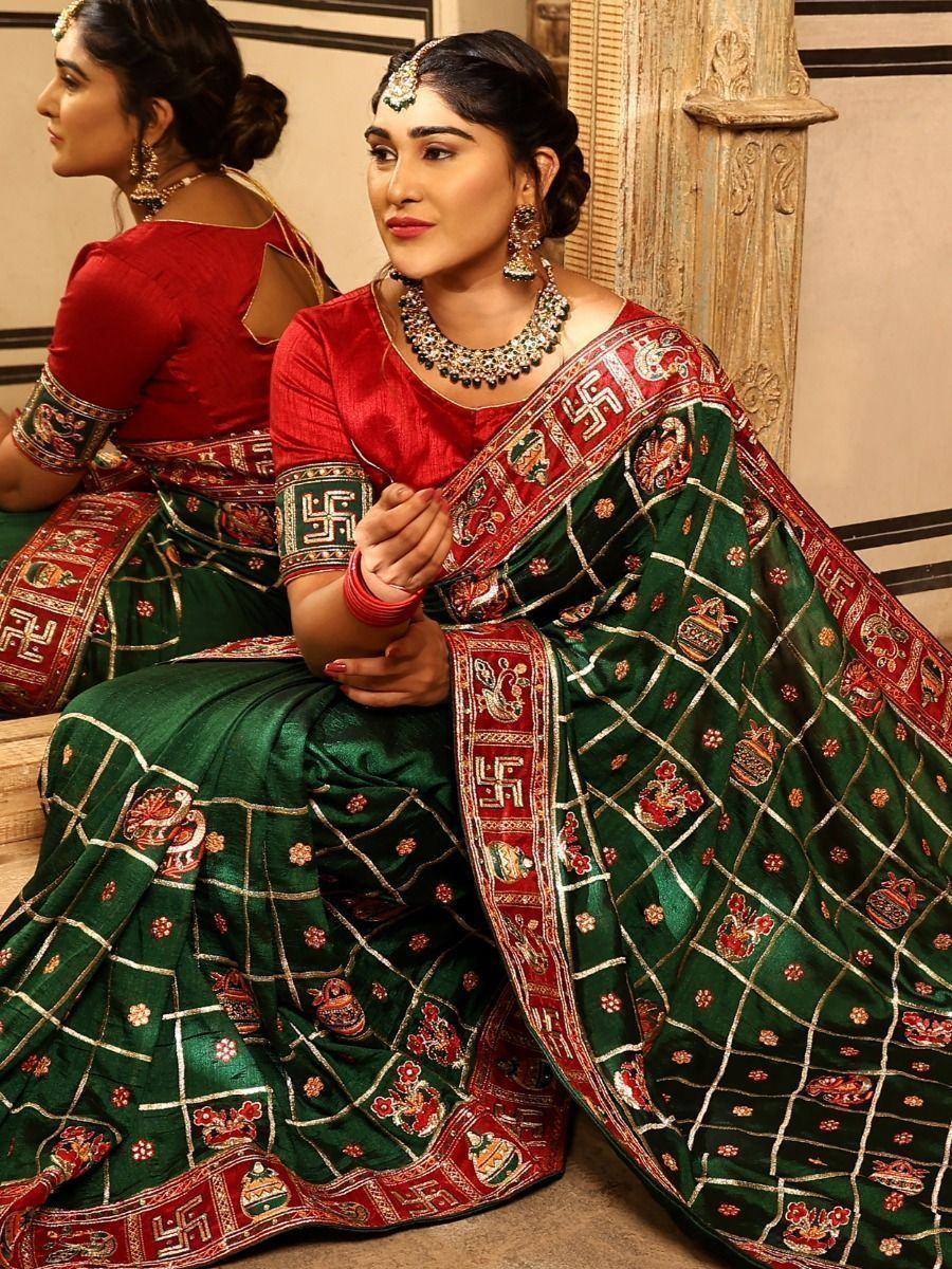 Green and red embroidered saree with traditional motifs, perfect for Indian ethnic wear occasions