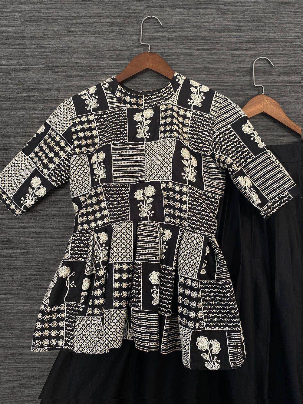 Black and white embroidered patchwork ethnic top with floral patterns, perfect for Indian wear