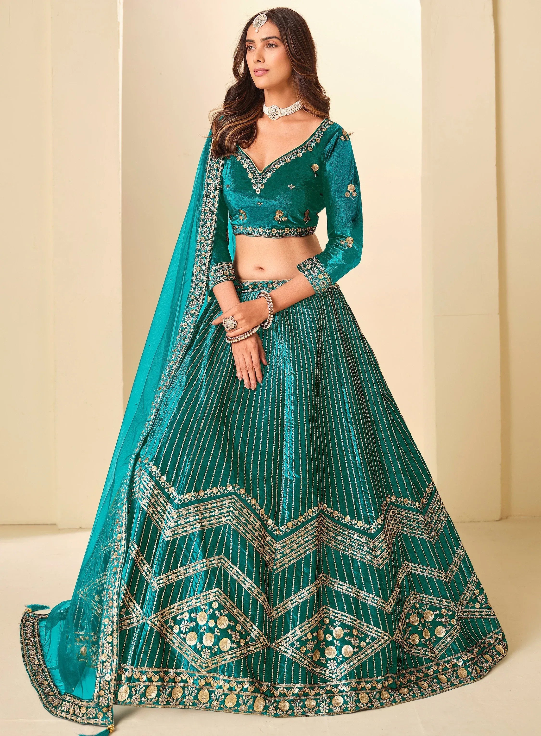 Graceful Teal Blue Embroidered Velvet Reception Wear Lehenga Choli