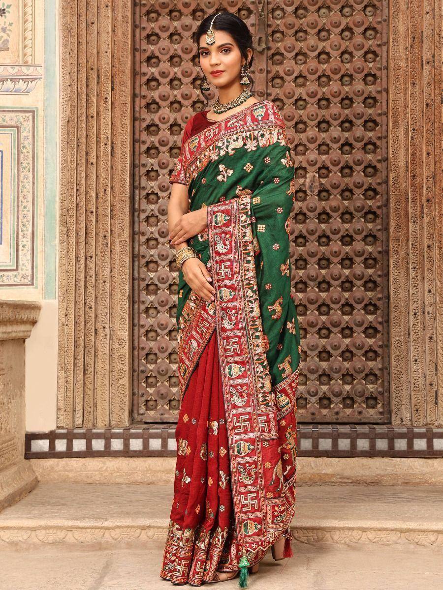 Green and red embroidered saree with traditional Indian motifs, perfect for ethnic occasions