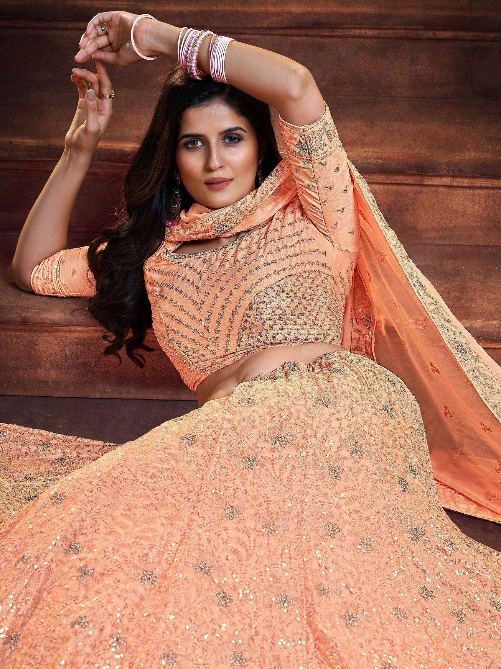 Peach designer lehenga choli with sequin embroidery, perfect for Indian ethnic wear occasions