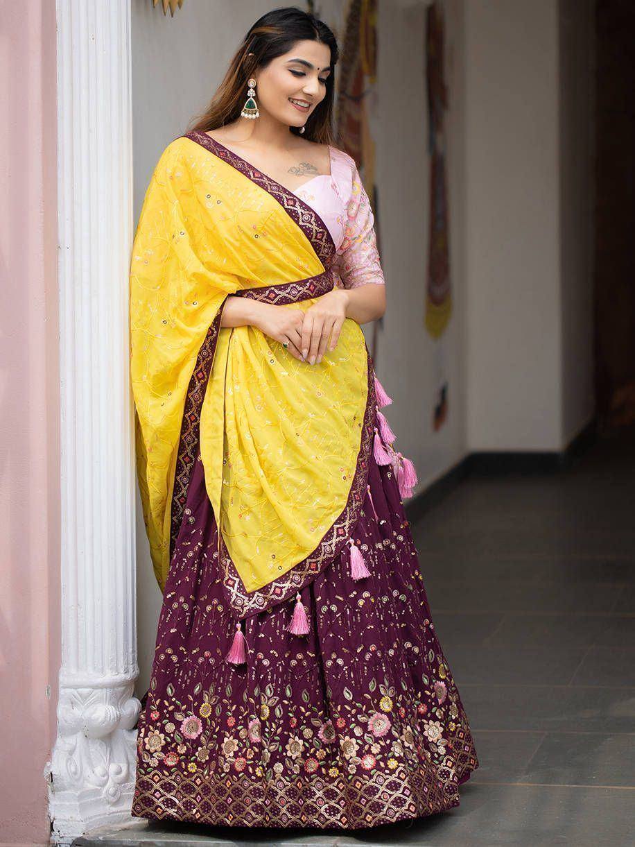 Yellow and maroon floral lehenga choli with tassels, perfect for Indian ethnic occasions