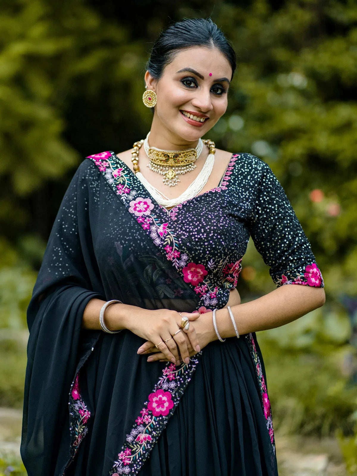 Black sequin ethnic gown with pink floral embroidery, perfect for Indian occasions