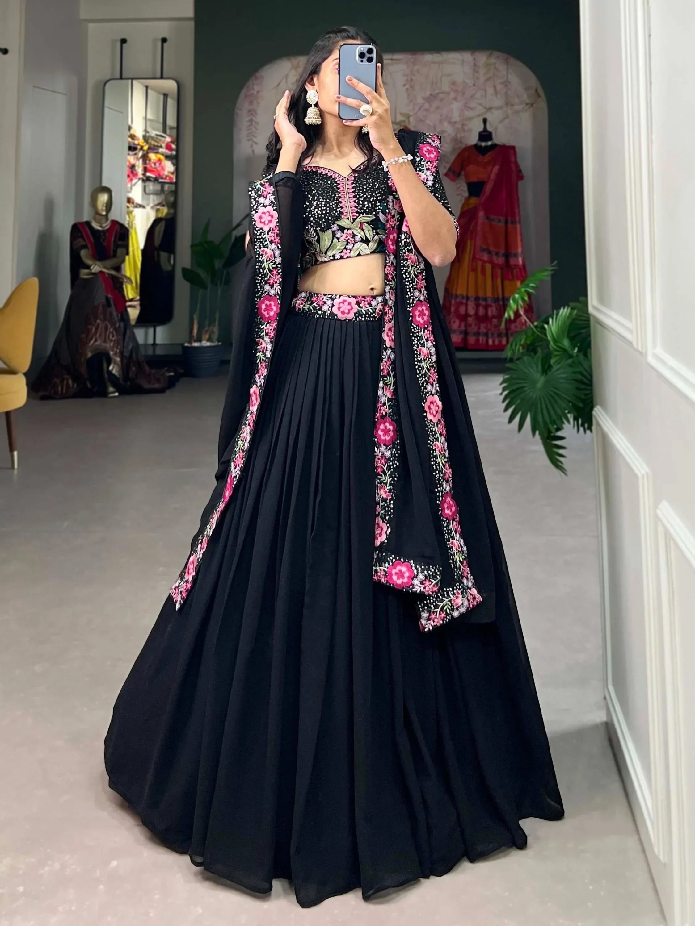Black floral embroidered lehenga choli with pink detailing, perfect for Indian ethnic wear occasions