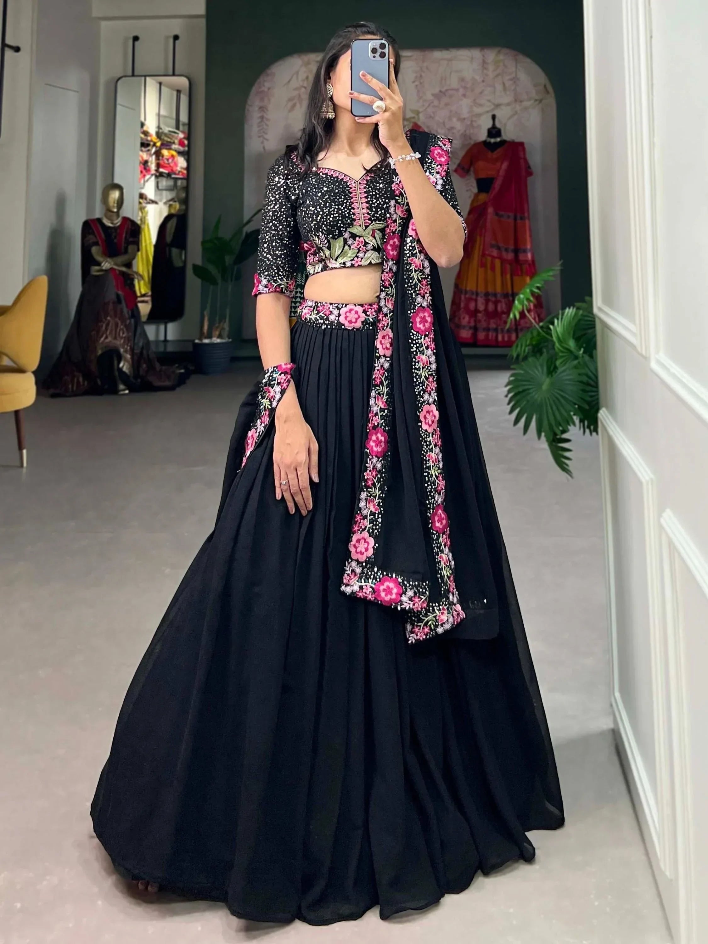 Black lehenga choli with pink floral embroidery, perfect for Indian ethnic wear events