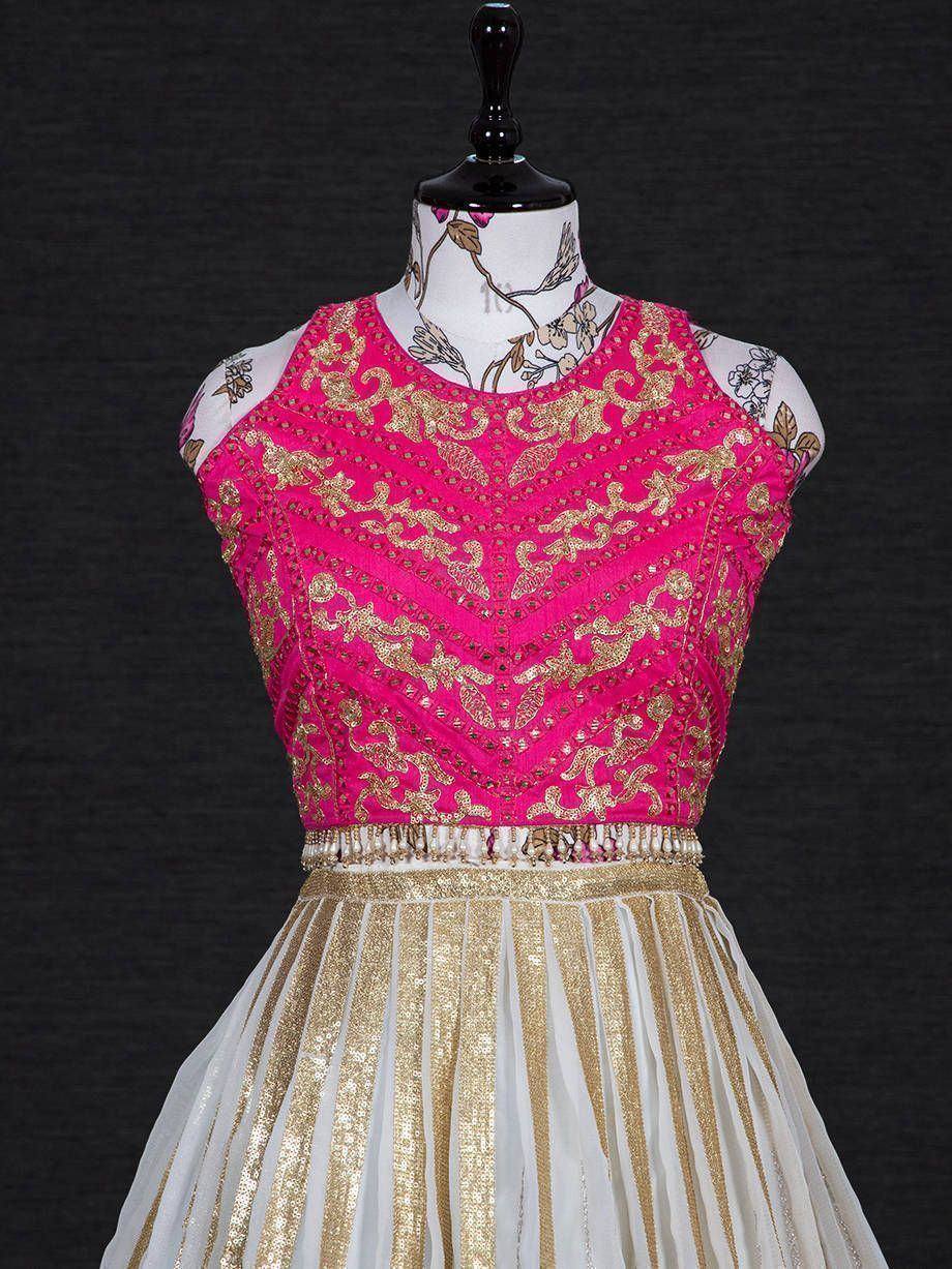 Pink and gold embroidered ethnic gown with pleated skirt, perfect for Indian celebrations