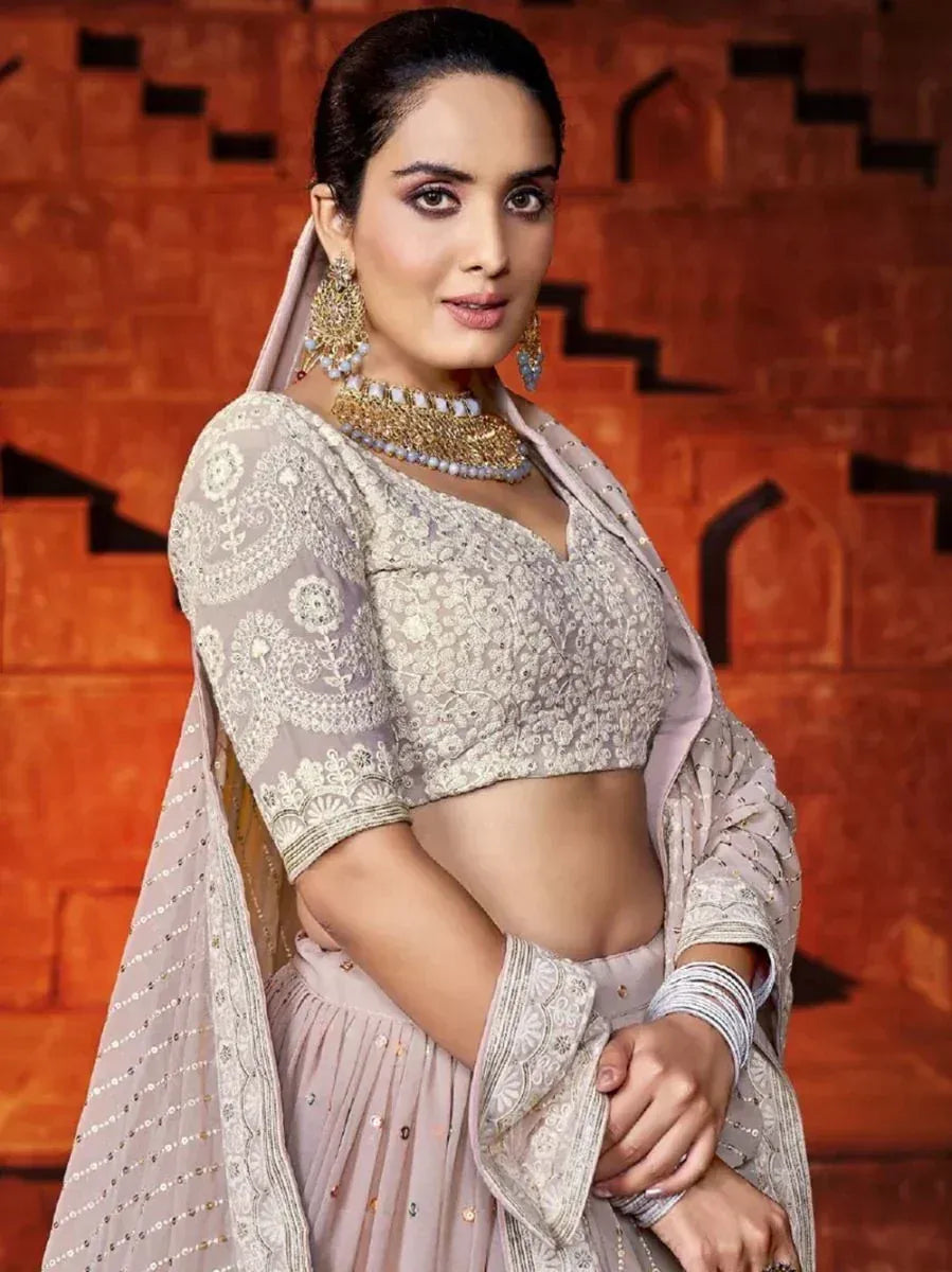 Elegant beige embroidered lehenga choli with dupatta, perfect for Indian ethnic wear occasions