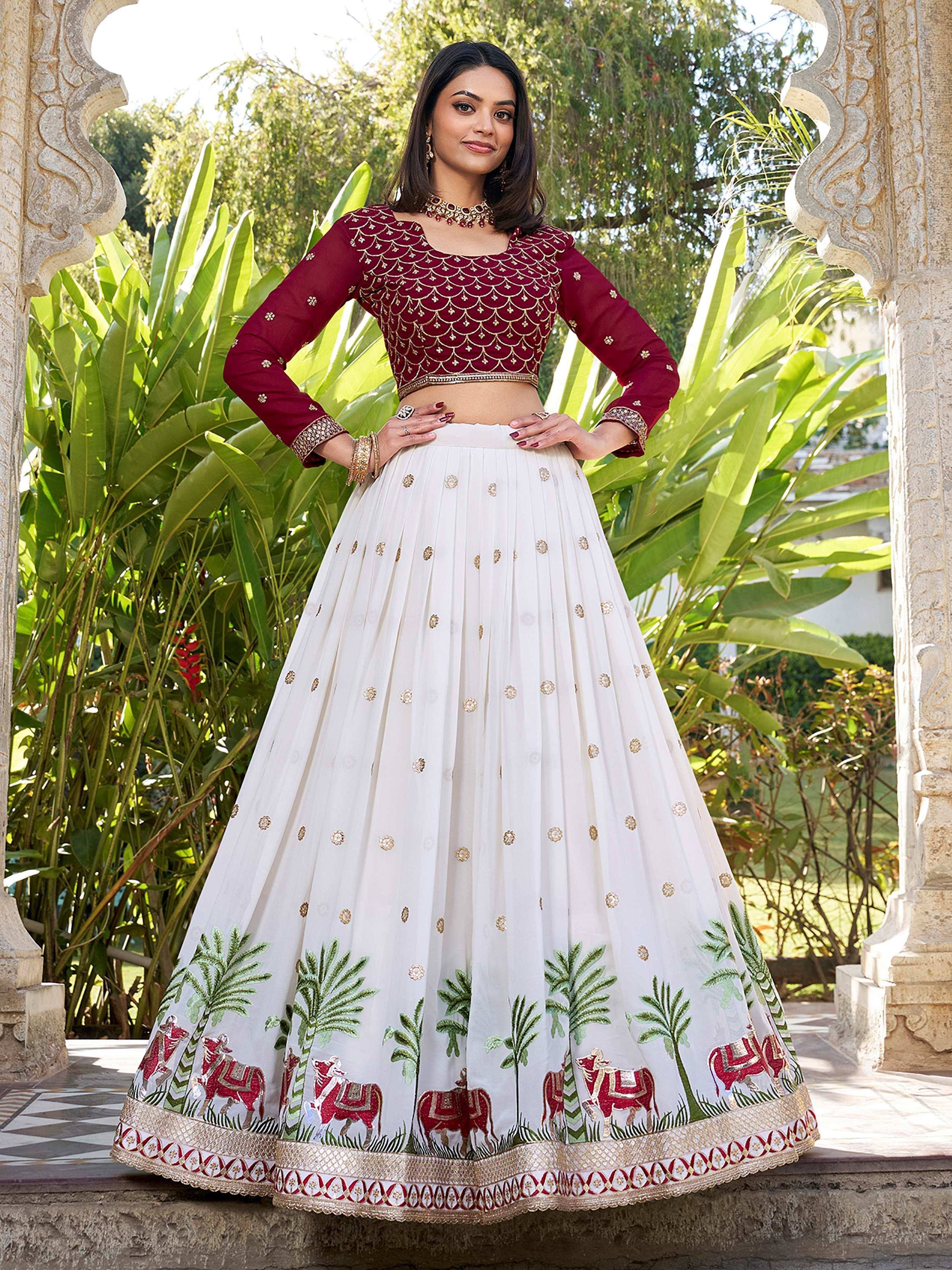 Maroon and white embroidered lehenga choli with elephant and palm motifs, perfect for Indian ethnic occasions