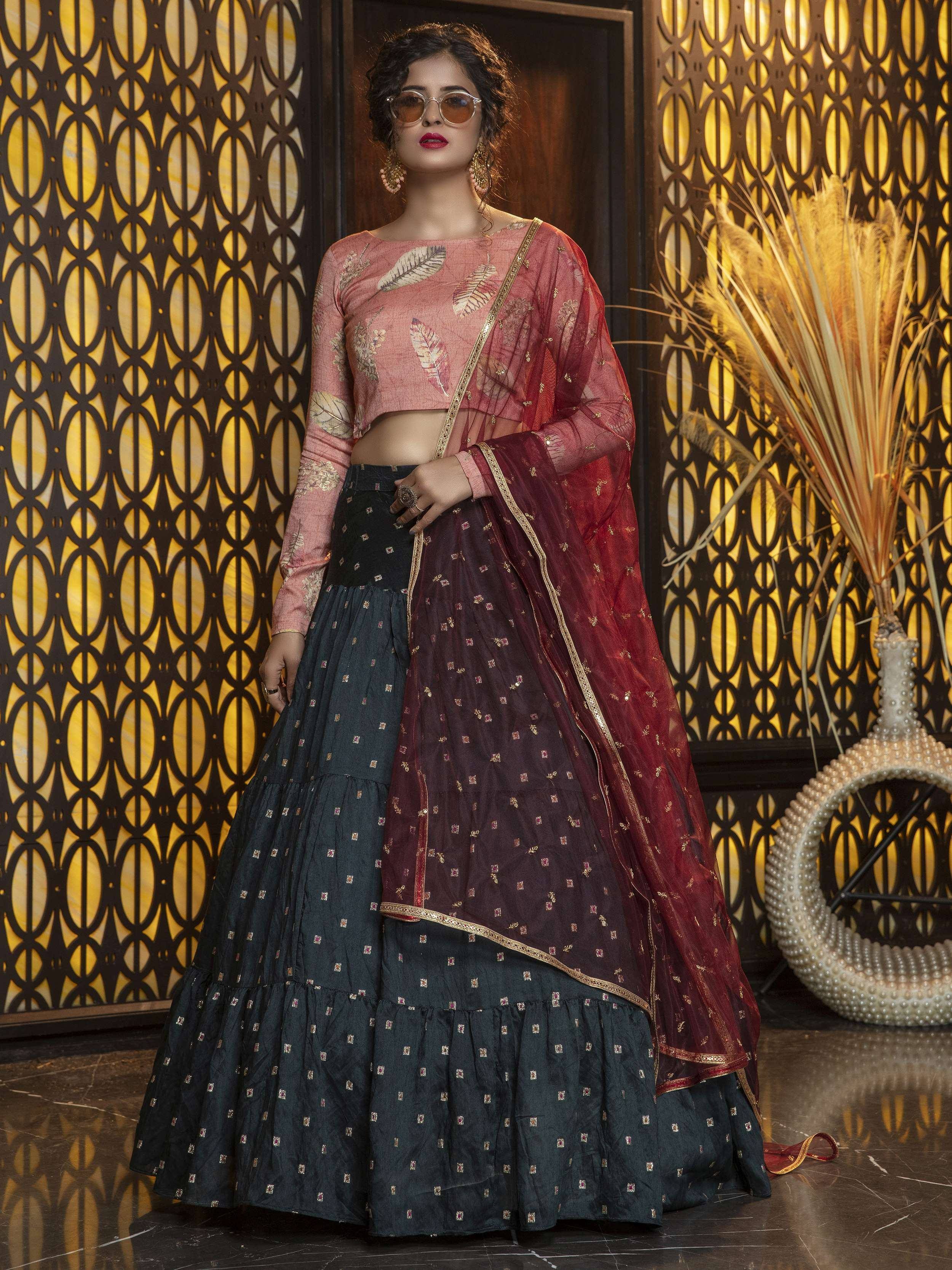 Stylish Indian lehenga choli with leaf print blouse, tiered skirt, and maroon dupatta for festive occasions