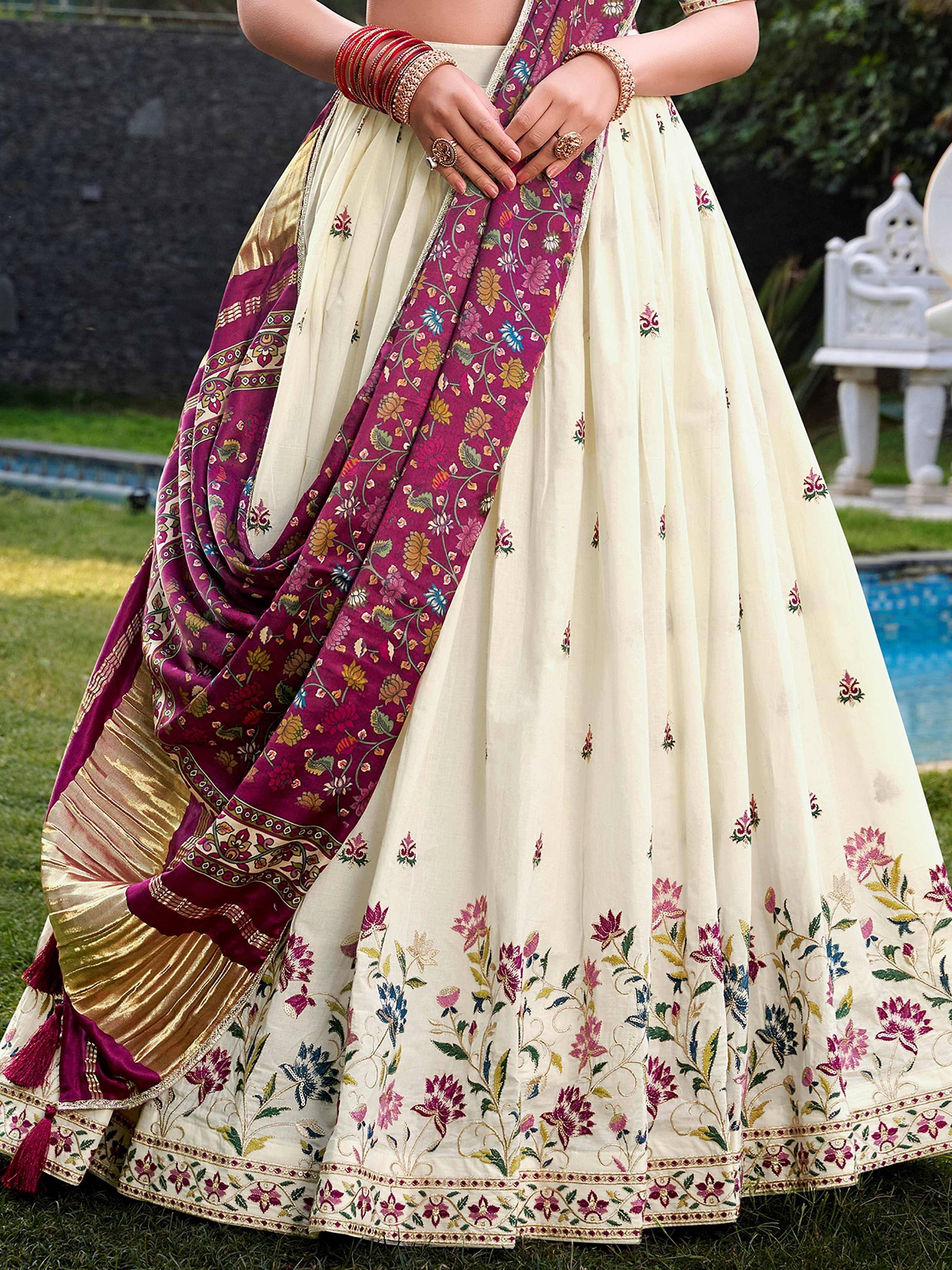 Cream and maroon floral embroidered lehenga choli with dupatta, perfect for Indian ethnic occasions.