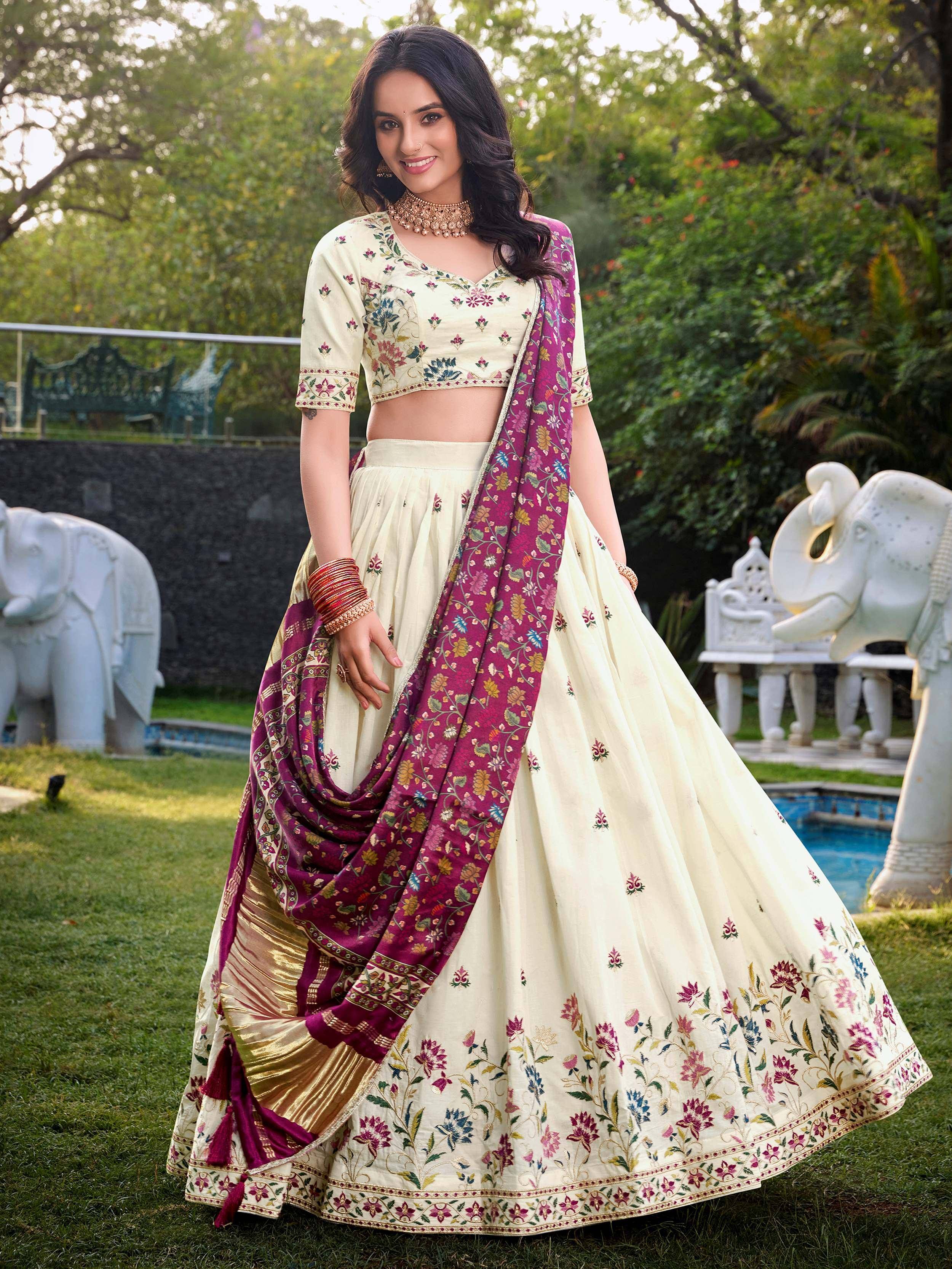 Cream floral embroidered lehenga choli with maroon dupatta, perfect for Indian ethnic wear occasions.