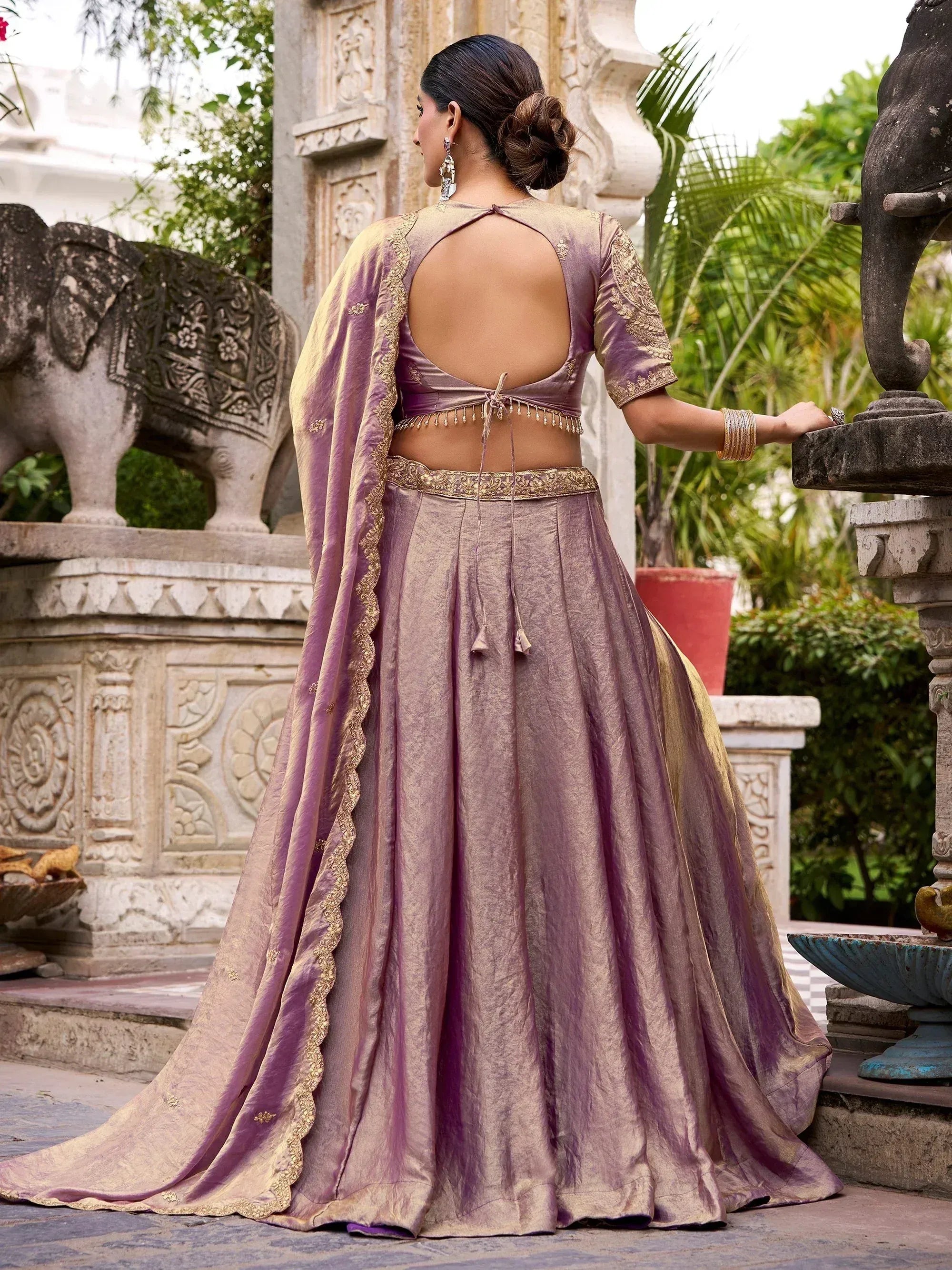 Purple designer lehenga choli with gold embroidery, back view, ethnic wear for women