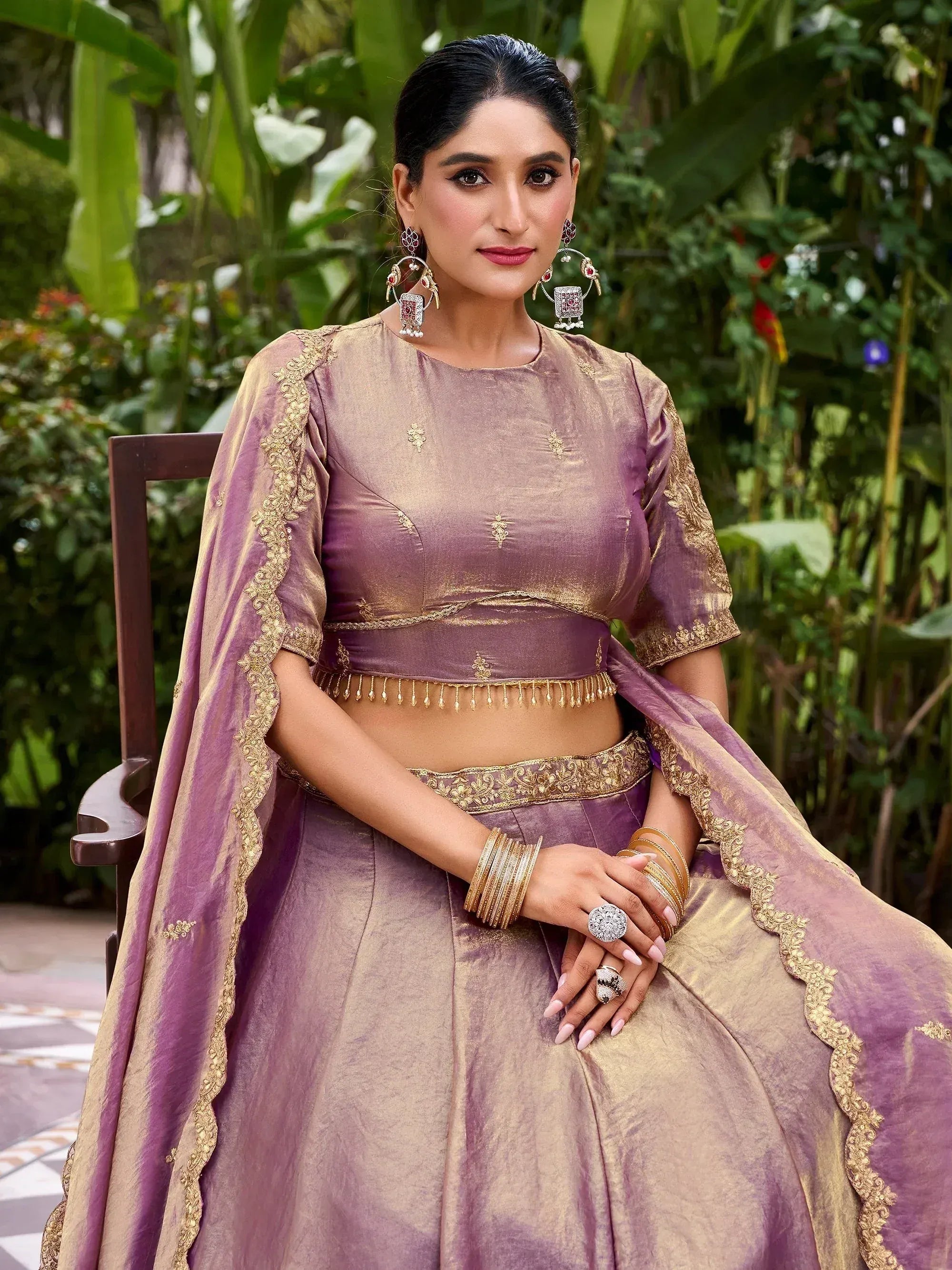 Elegant purple and gold lehenga choli with intricate embroidery, perfect for Indian ethnic wear occasions.