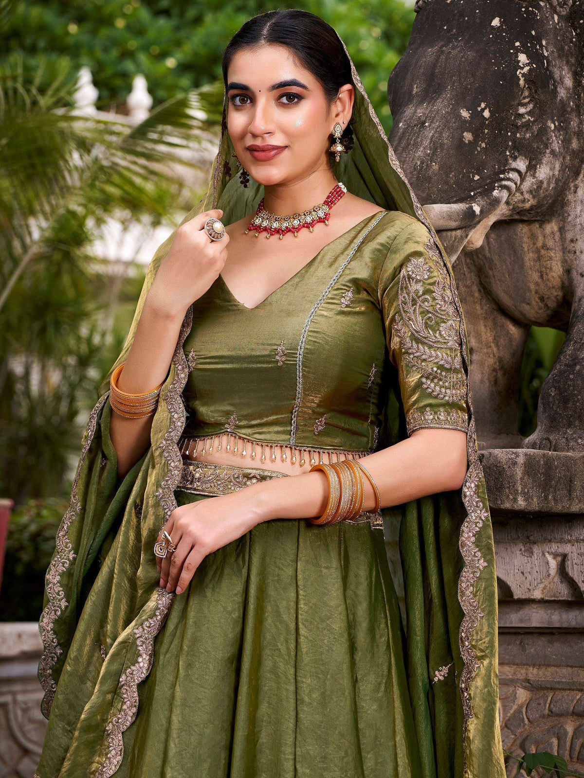 Olive green designer lehenga choli with gold embroidery, perfect for Indian ethnic wear occasions