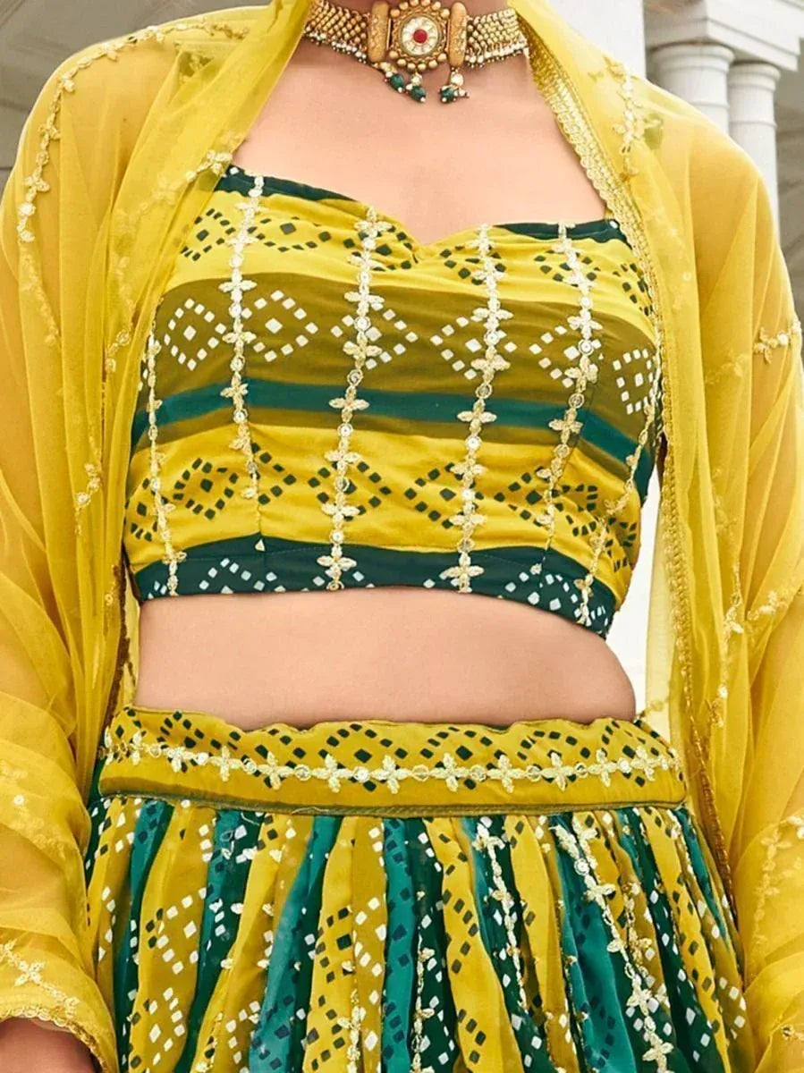 Yellow and green embroidered lehenga choli with sheer dupatta, perfect for Indian ethnic occasions