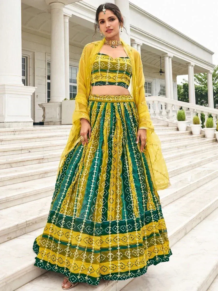 Yellow and green designer lehenga choli with intricate embroidery, perfect for Indian ethnic wear occasions.