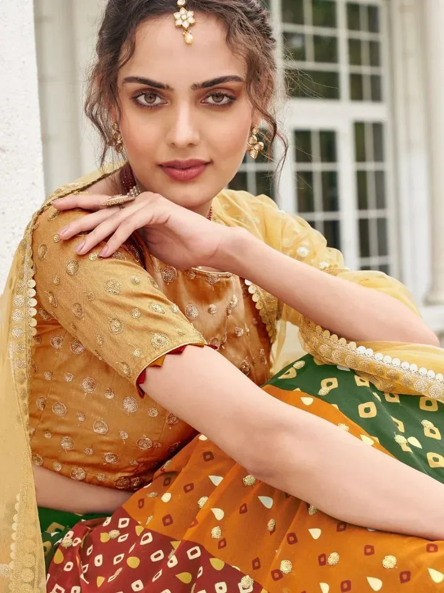 Woman in elegant Indian ethnic saree with gold embroidery and colorful patterns, styled with traditional jewelry